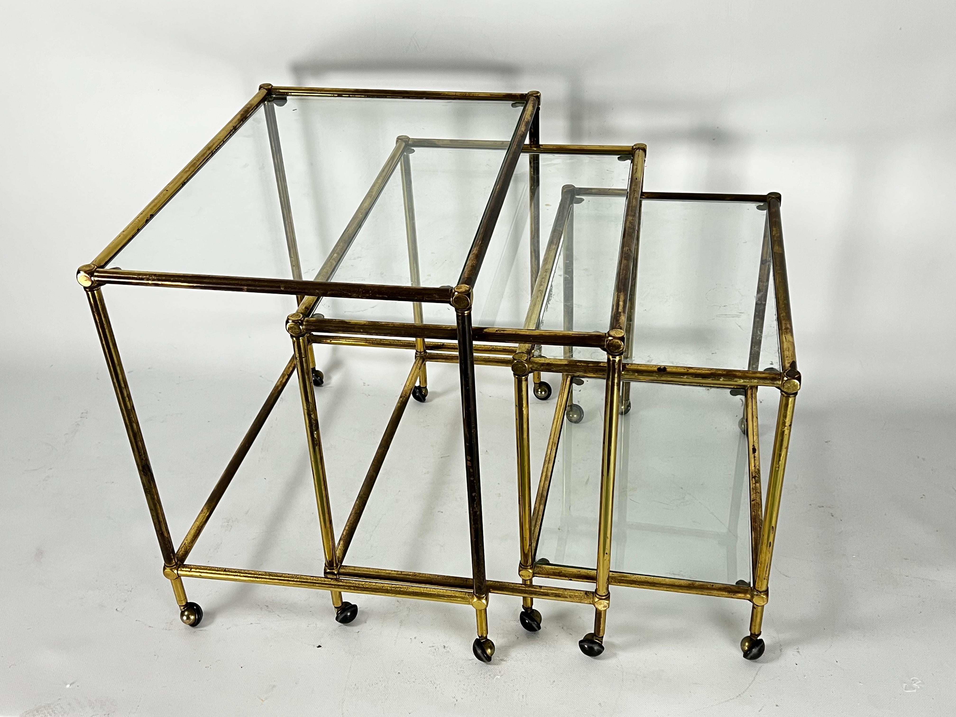 20th Century Mid-Century nesting set of three bar carts in brass and glass. Italy 1950s For Sale