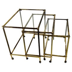 Vintage Mid-Century nesting set of three bar carts in brass and glass. Italy 1950s