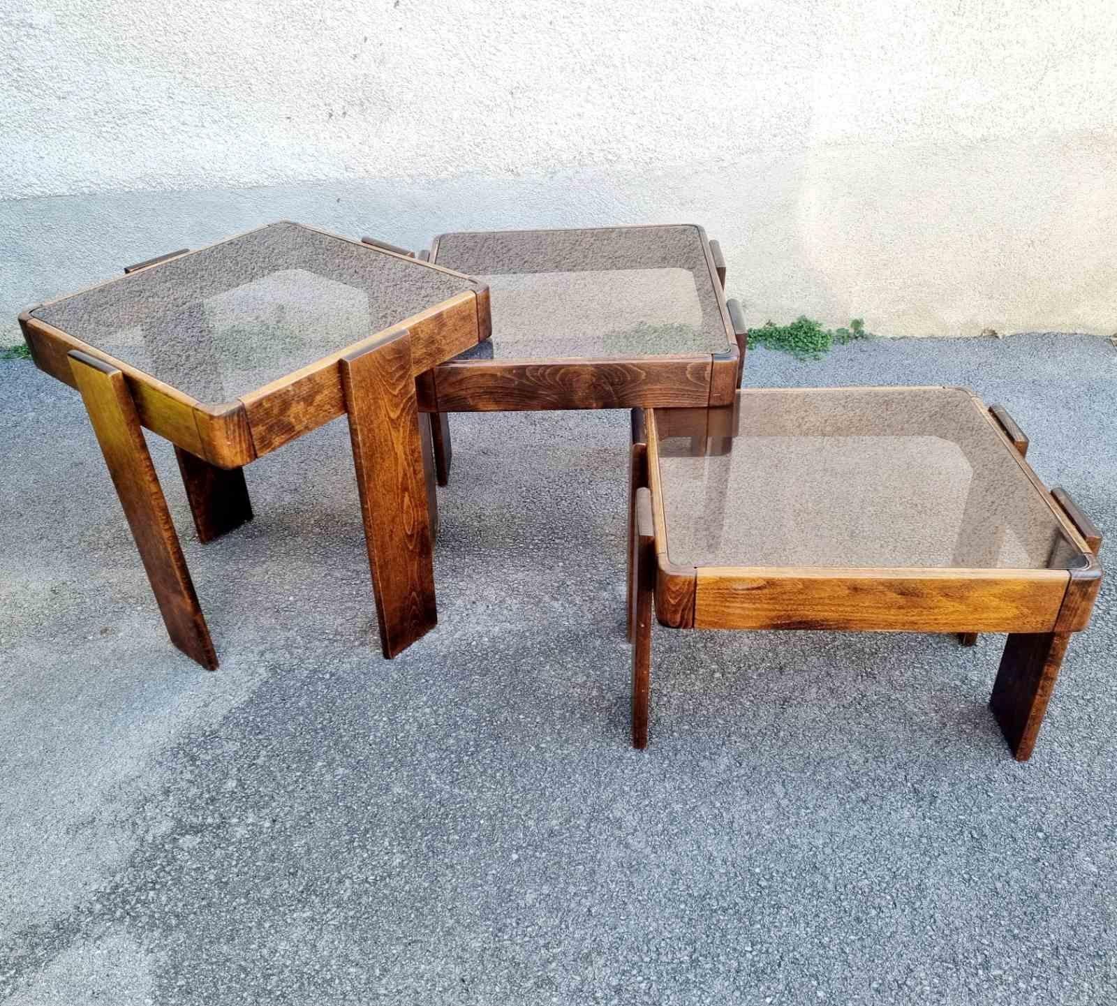 A set of three coffee nesting tables made in the former Meblo furniture factory in the former Yugoslavia. The tables are designed by Gianfranco Frattini for Cassina. 
Gianfranco Frattini is an Italian architect who was part of the biggest Italian