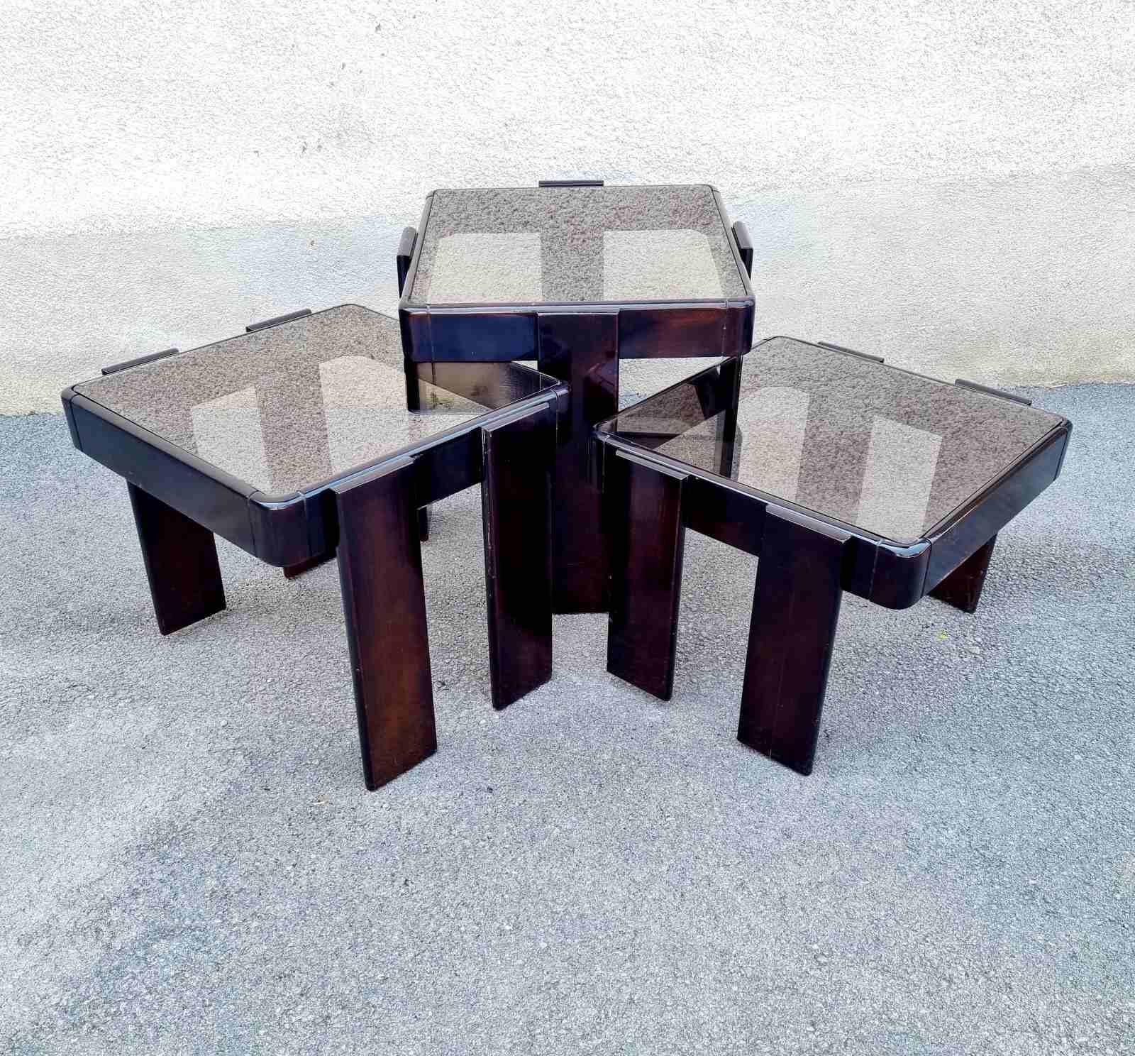 A set of three coffee nesting tables made in the former Meblo furniture factory in the former Yugoslavia. The tables are designed by Gianfranco Frattini for Cassina. 
Gianfranco Frattini is an Italian architect who was part of the biggest Italian