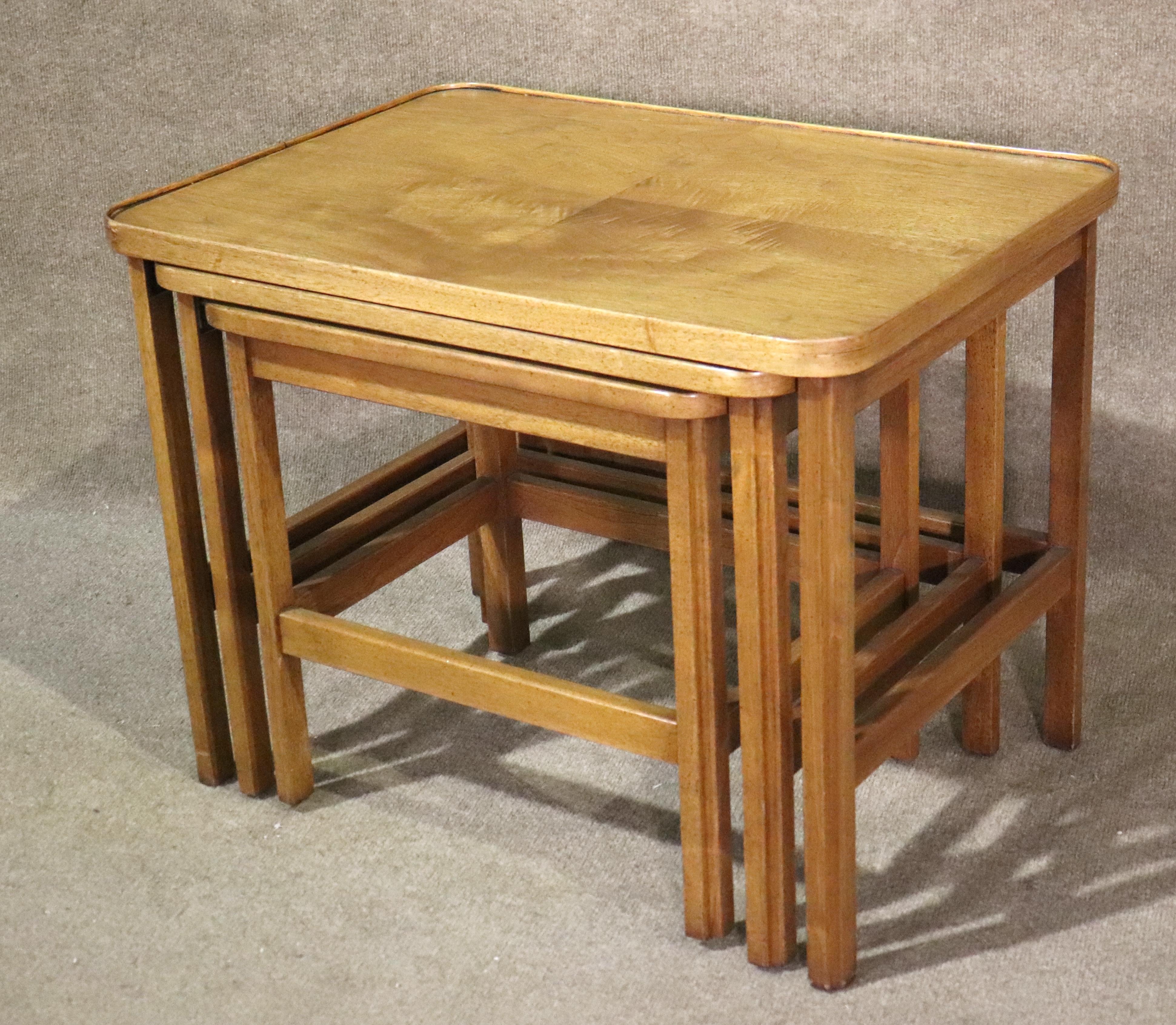 Set of three side tables that nest inside each other for easy storage. Warm walnut grain tops with curved corners.
Please confirm location NY or NJ