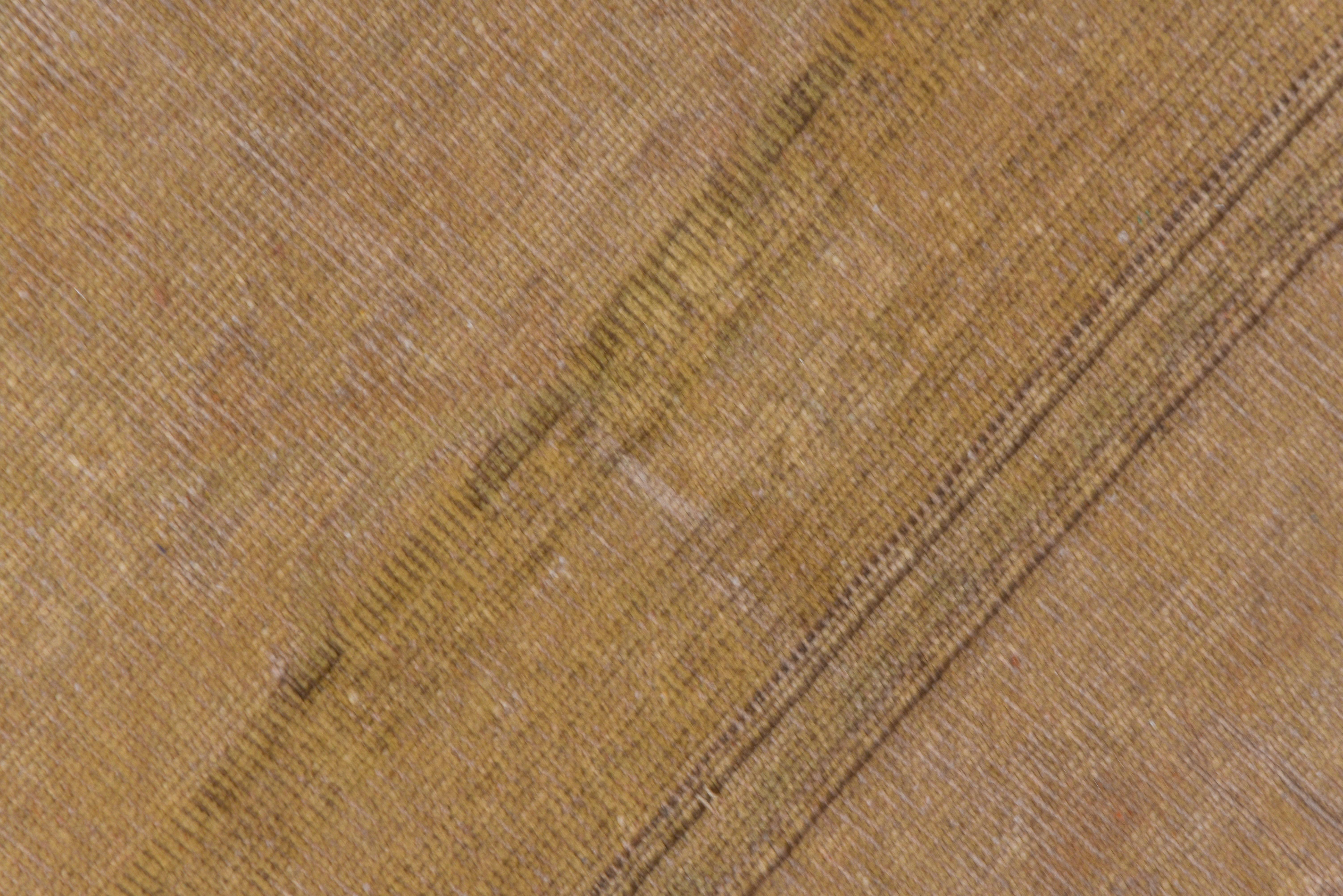 Melas from the SW Turkish coast, this square vintage scatter is dominated by thin bundles of dark brown striations on the light brown field with sand details.