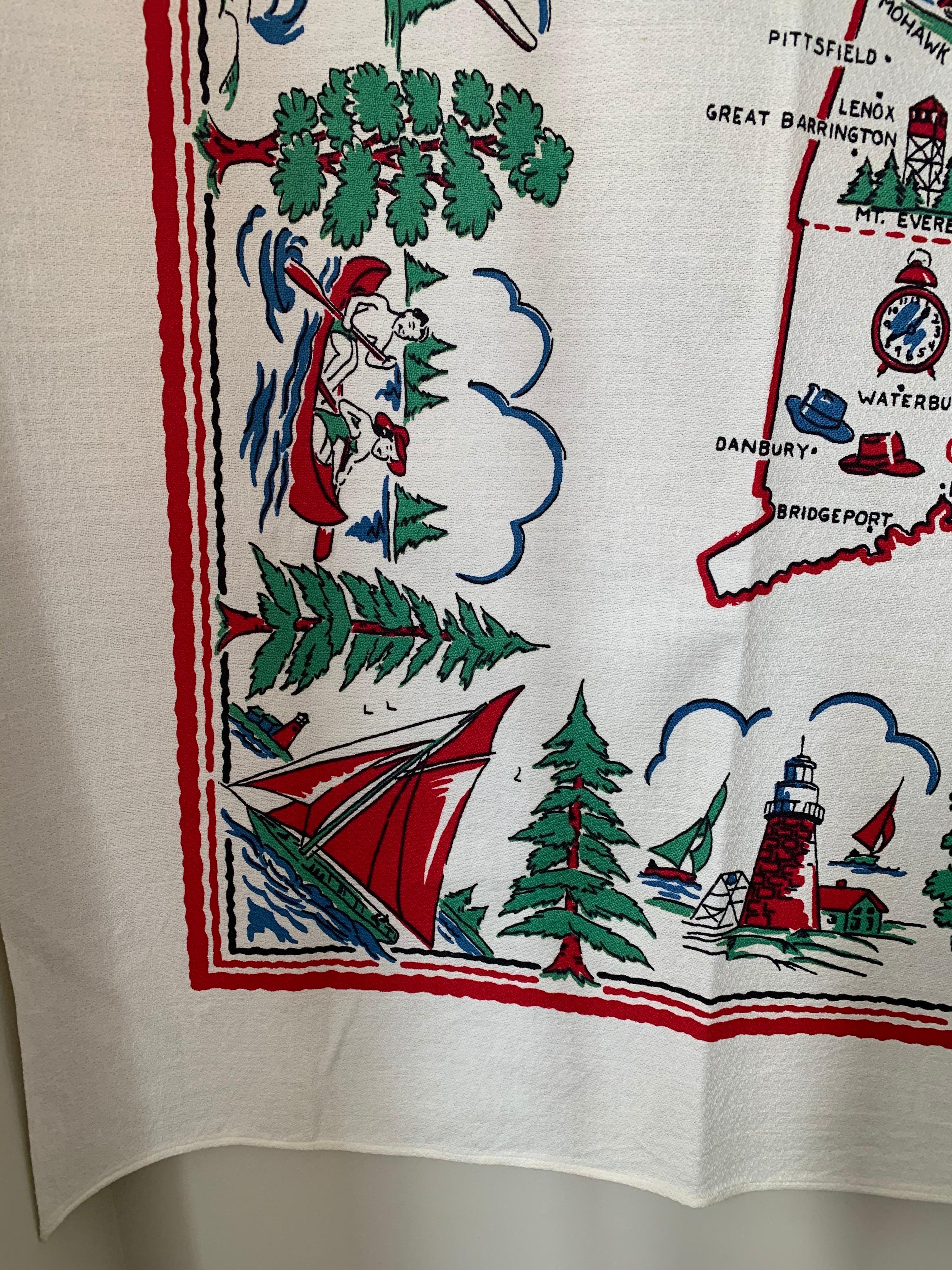 Mid-century New England souvenir table cloth. White cotton with all over multicolor printed design featuring New England (Northeast) landmarks.