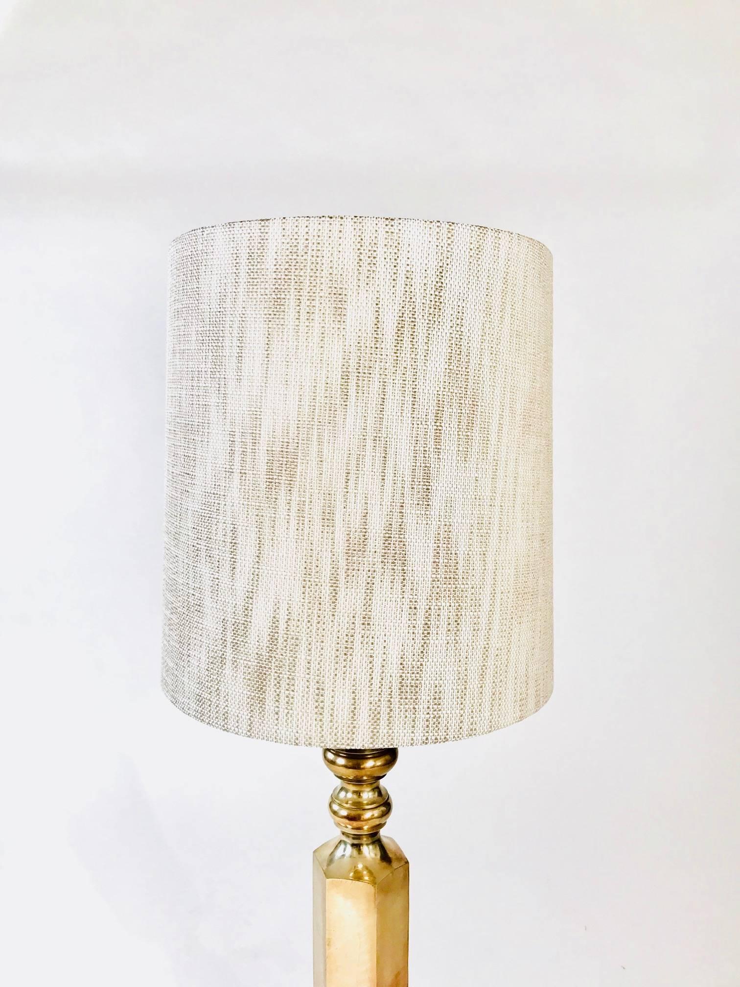 Beautiful nickel-plated table lamp featuring a thick shaped bass. The lamp has an absolutely beautifully patina. There are a couple of spots on the base that can easily be sanded off. We have not used any cleaner yet but could definitely be