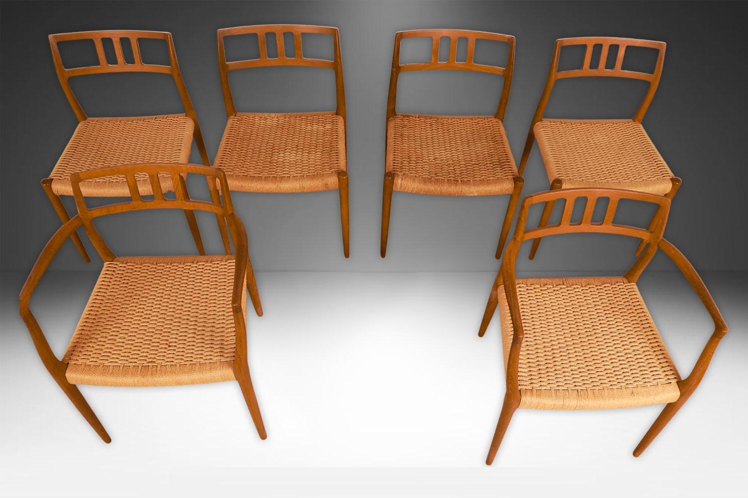 Set of 6 teak Danish Modern paper cord Dining chairs by famous designer Niels Otto Møller for J.L Møller Møbelfabrik in Denmark. The four side chairs (Model #79) and two Captain armchairs (model #64) are rare models to find. A stunning set of 6,