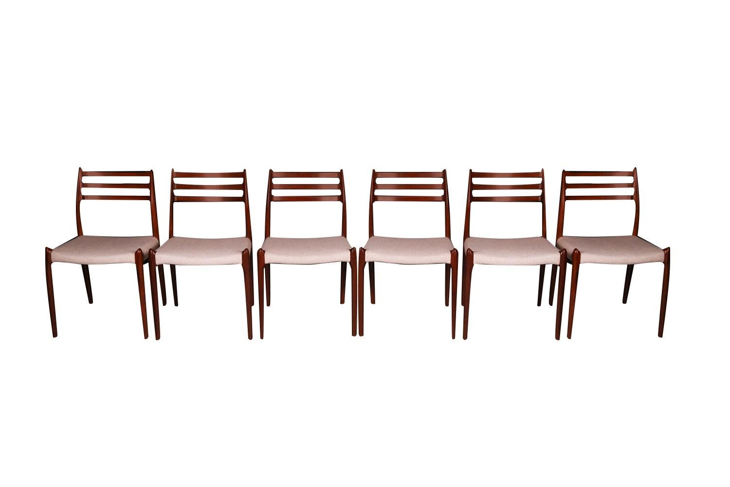 An absolutely stunning set of six Mid-Century Danish Modern Rosewood dining chairs model 78 designed by Niels Otto Moller for J.L. Møllers Møbelfabrik in Denmark. Makers Stamp (Moller Models made in Denmark) underneath seats. These gorgeous chairs