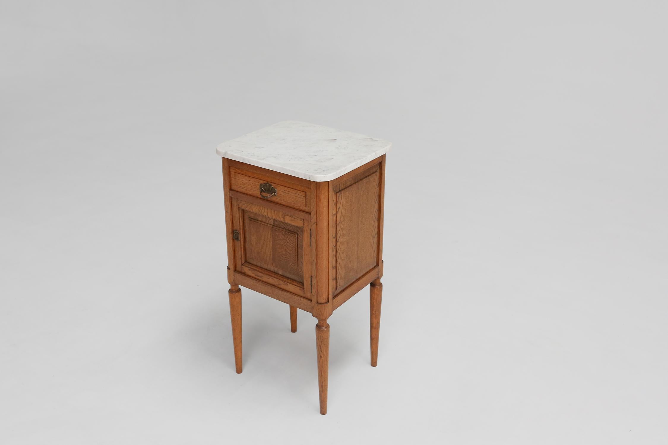 Midcentury nightstand made circa 1950 with a Carrara marble top.