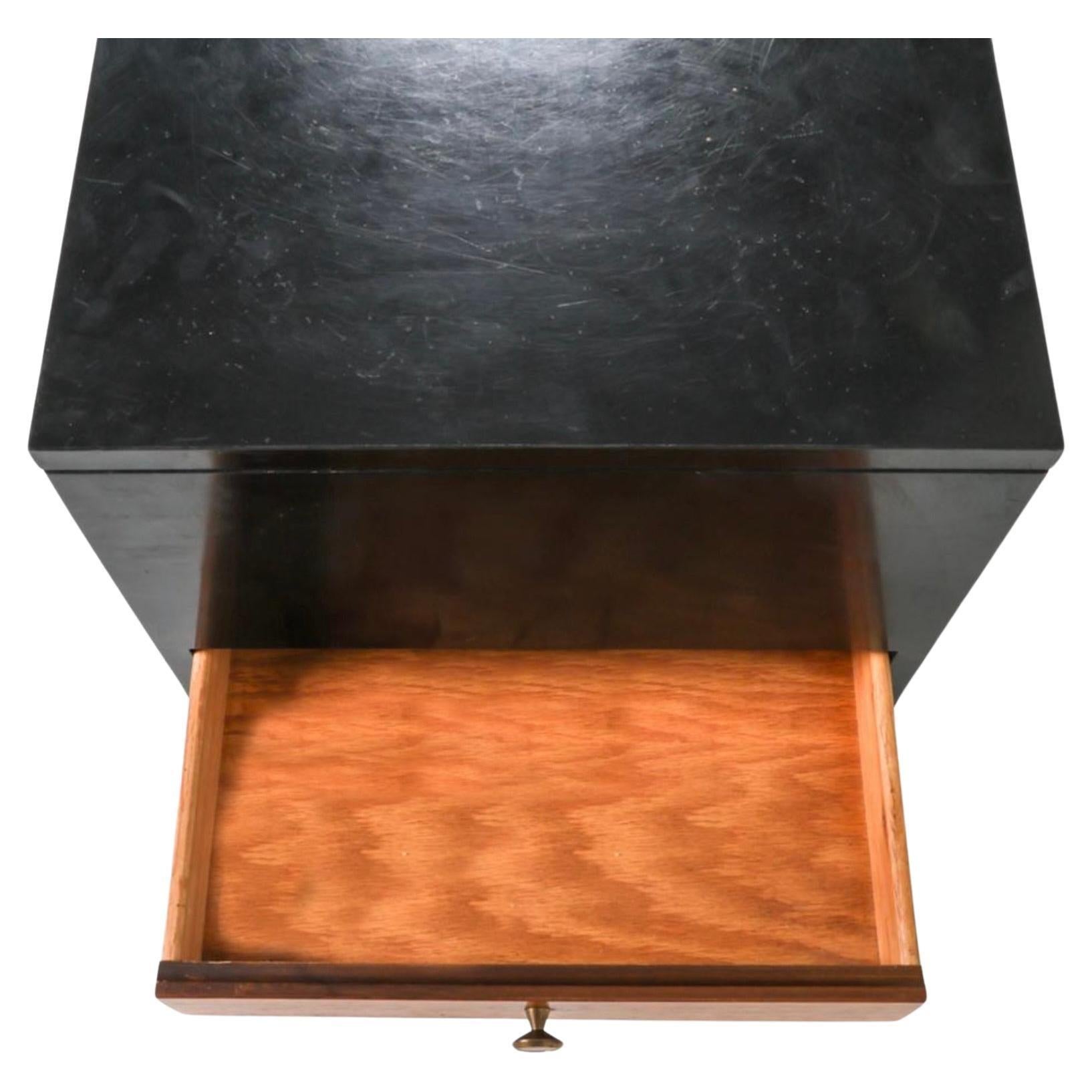 Unique Mid century nightstand center Cube table with 4 drawers black lacquer rosewood. All Black Lacquer with Rosewood drawers (1) on each side. Brass hardware. Shows signs of use. Made in USA. Located in Brooklyn NYC.

Dimensions: H 19
