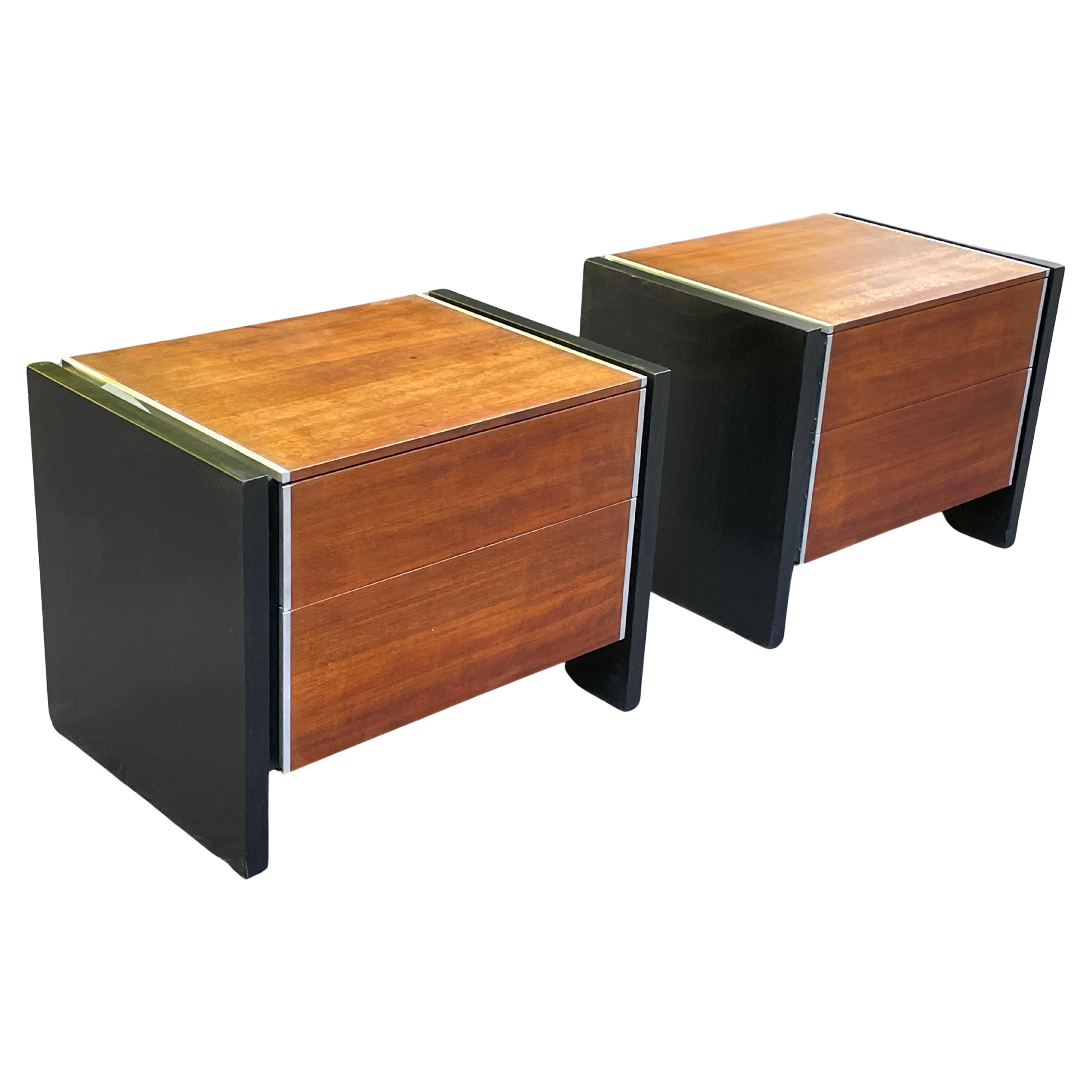 Pair of Mid-Century Modern night stands by Robert Baron in walnut and aluminum. Produced by Glenn of California. Minimalist design. Good original condition with minor wear as expected with age.

Signed in each drawer with Glenn of California