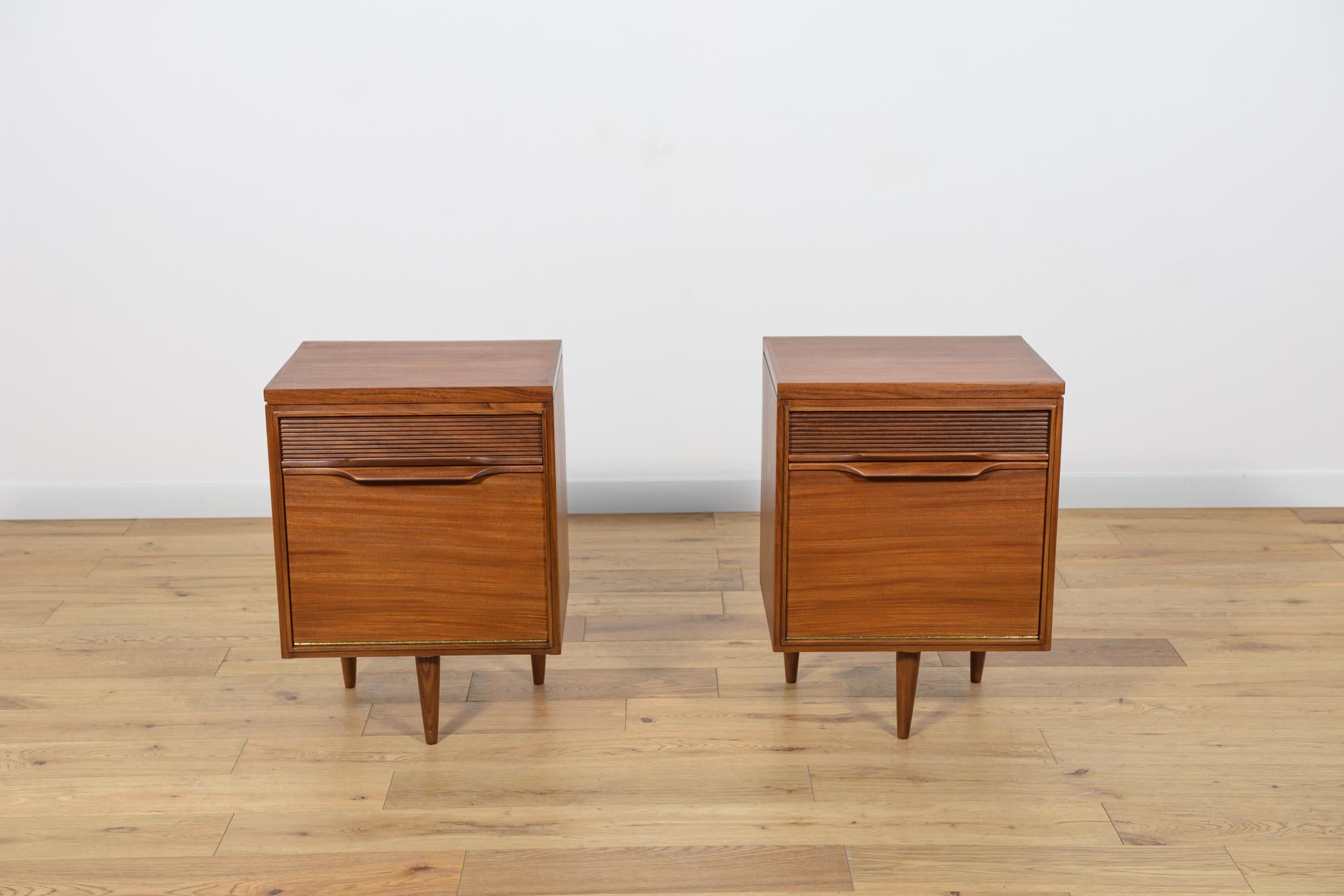 
A pair of bedside tables manufactured by the British White & Newton manufactory in the 1960s in Portsmouth. The furniture consists of a cabinet located in the lower part and a drawer. Grooved drawers and profiled handles give the cabinet