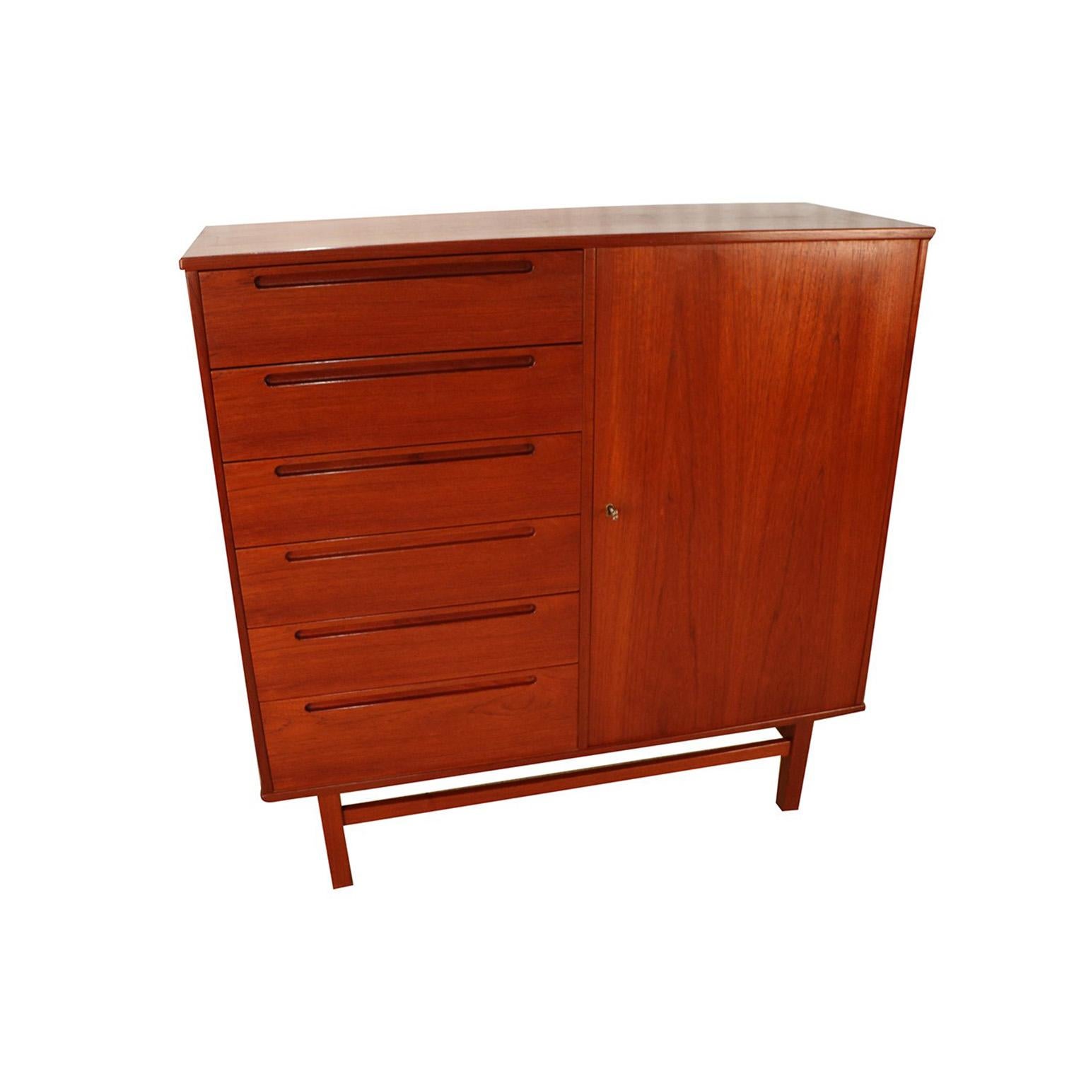 Handsome highboy gentleman’s chest designed by Nils Jonsson for Torring and manufactured by HJN Mobler, Denmark circa, 1960. Featuring Classic, clean modern lines and beautifully grained teak wood characteristic of Danish Mid-Century Modern design