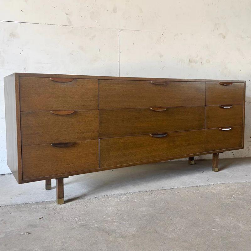 The stylish vintage elegance of this 1950s bedroom dresser from Harvey Probber features clean mid-century modern design, carved wood handles, and quality manufacture. Perfect nine drawer bedroom storage makes a striking vintage modern dresser for