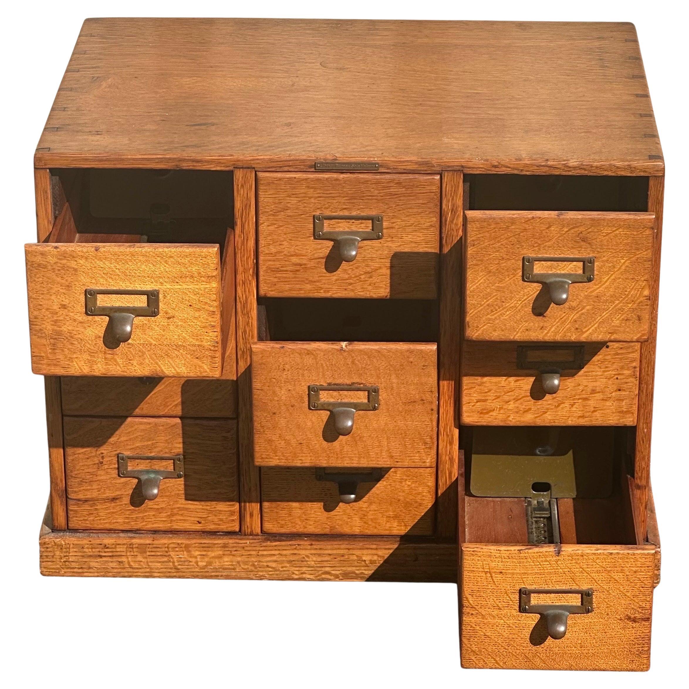 A very nice nine drawer library card catalog in quarter sawn oak by Library Bureau Sole Makers, circa 1950s. The piece is in very good vintage condition and finished on all sides with brass hardware pulls. It measures approximately 23.75