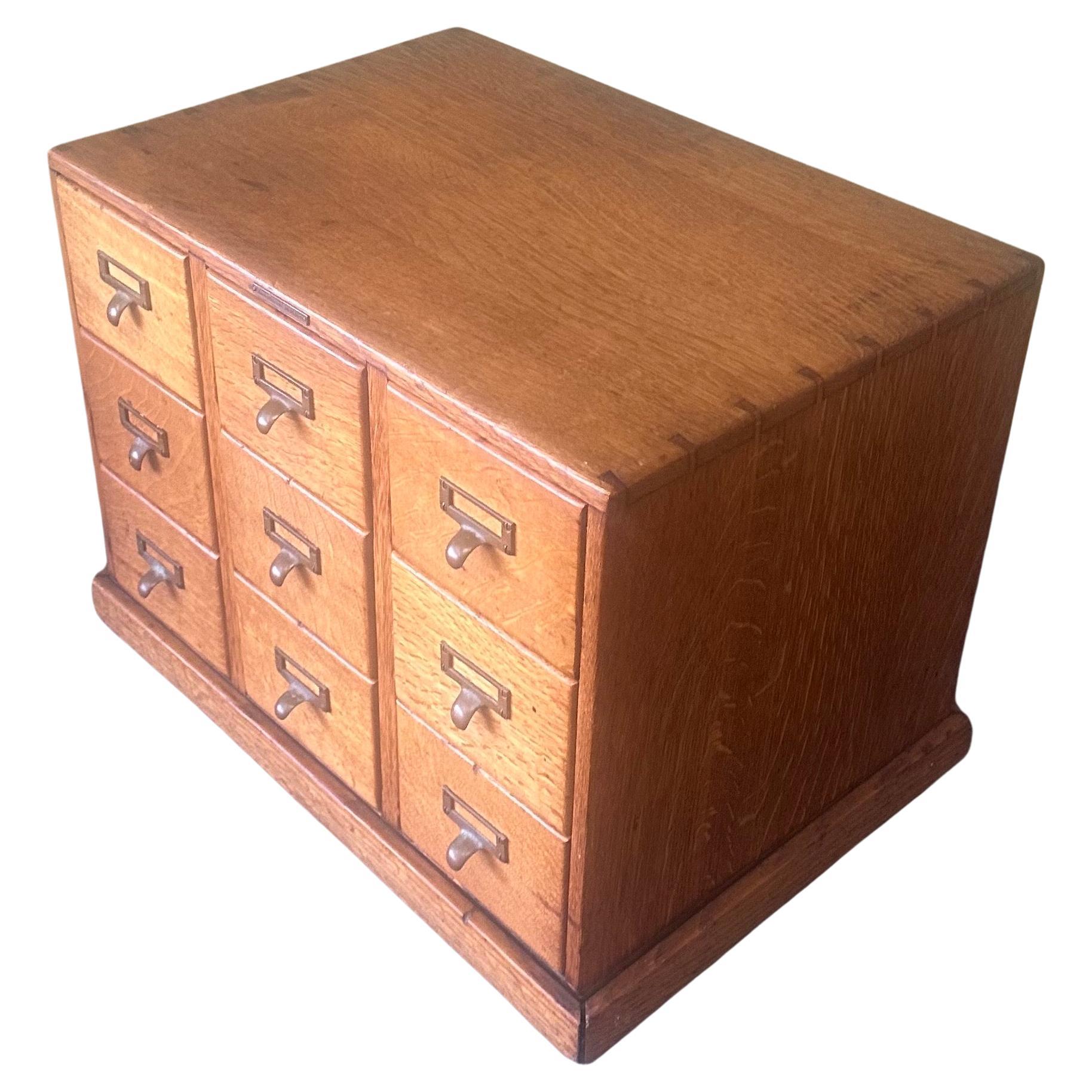 A very nice nine drawer library card catalog in quarter sawn oak by Library Bureau Sole Makers, circa 1950s. The piece is in very good vintage condition and finished on all sides with brass hardware pulls. It measures approximately 23.75