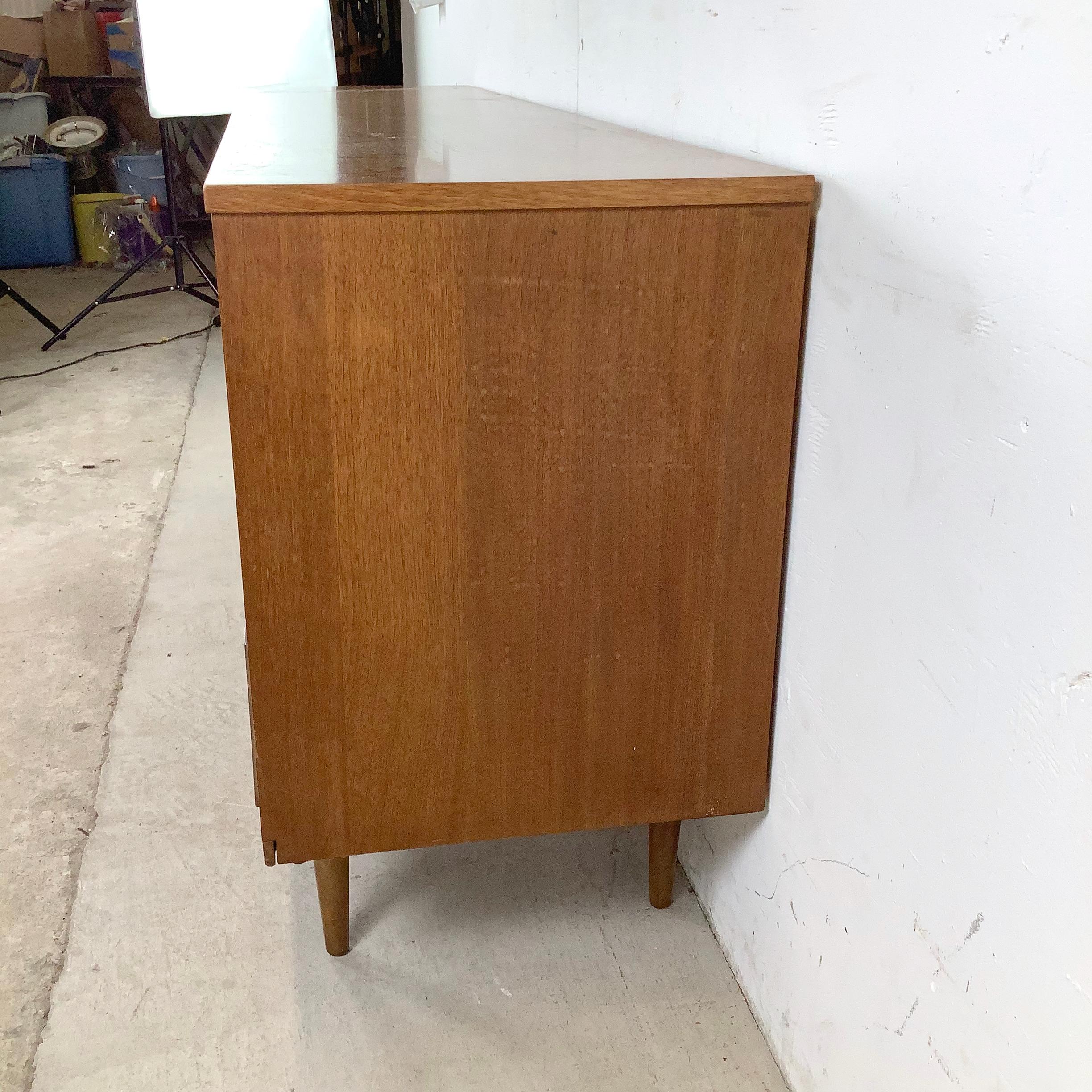 Mid-Century Nine Drawer Walnut Bedroom Dresser In Fair Condition For Sale In Trenton, NJ