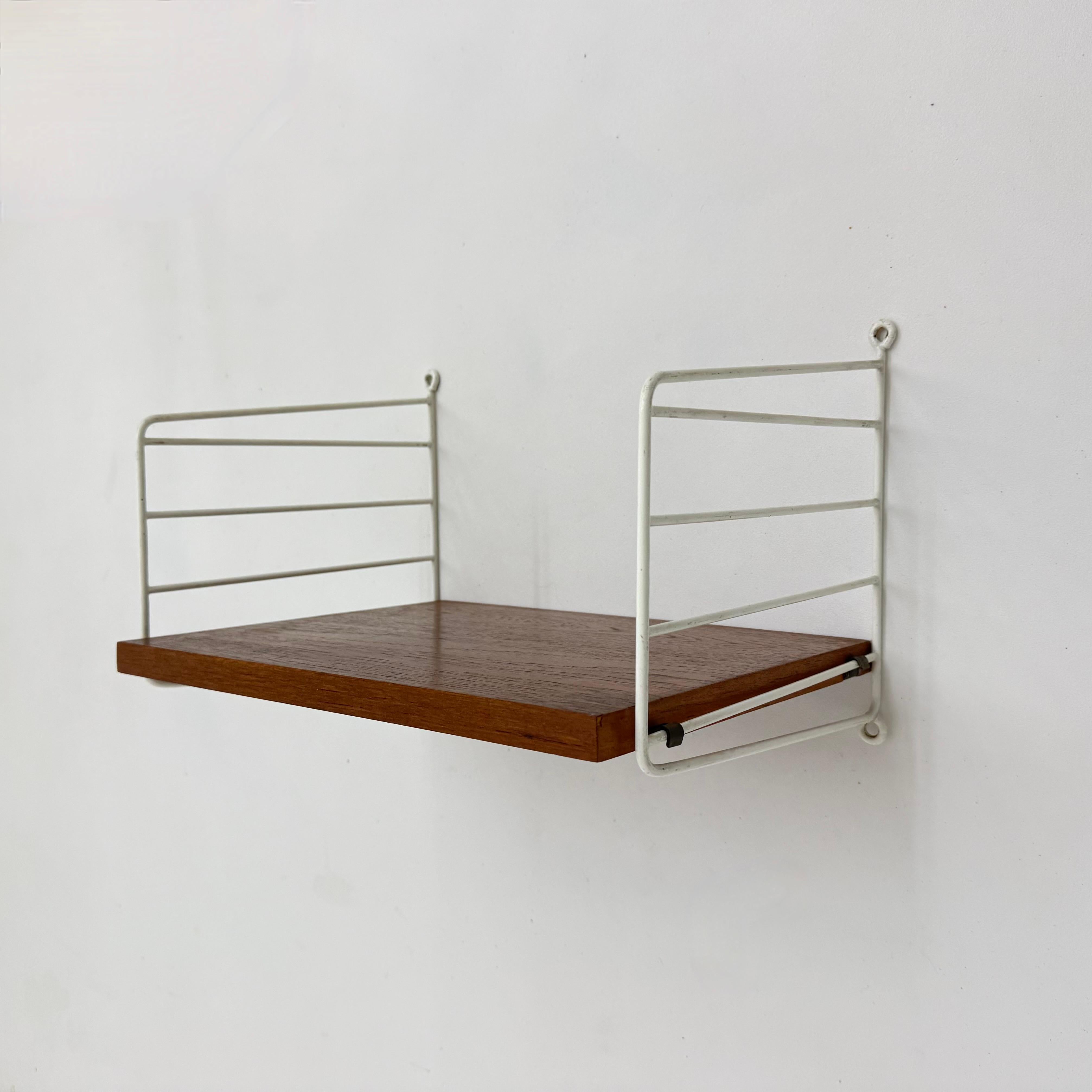 Metal Mid-Century Nisse Strinning string design teak wall unit , 1960s For Sale