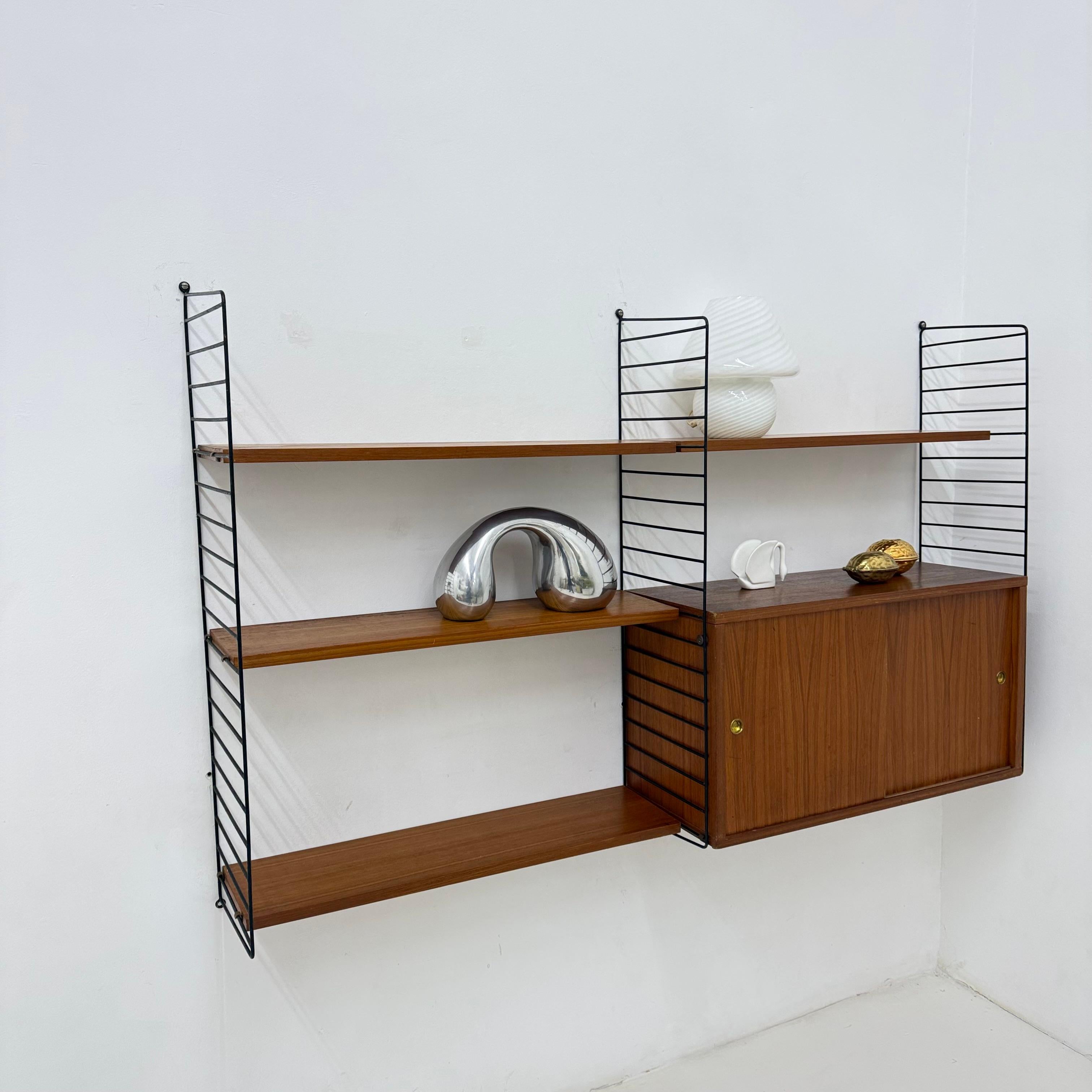 Metal Mid-Century Nisse Strinning string design teak wall unit , 1960s For Sale