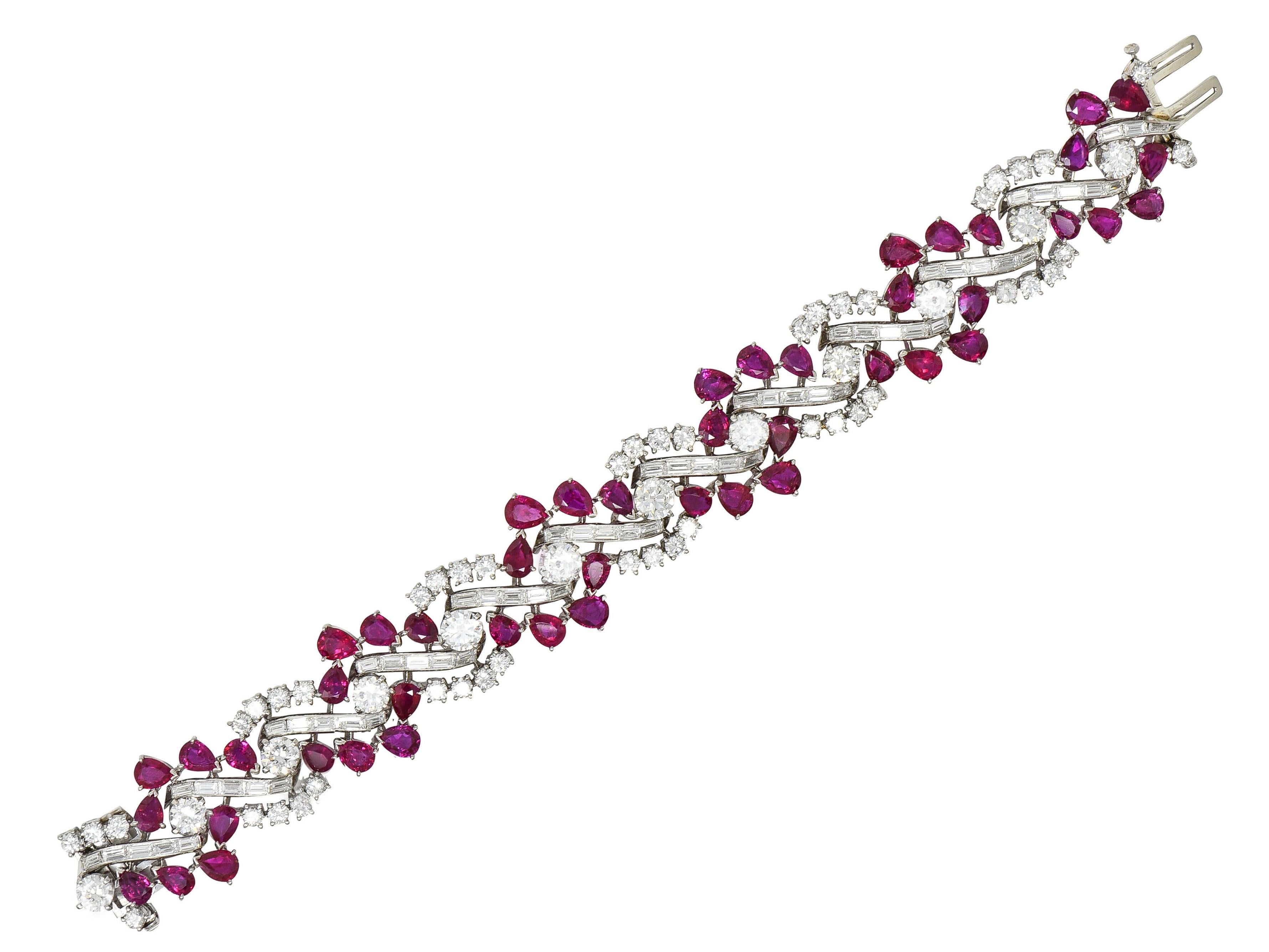 Comprised of hinged links prong set with rubies and diamonds as an undulating twist motif
Rubies are pear cut weighing approximately 29.60 carats total - well-matched red in color  
Natural Burmese in origin and displaying no indications of heat