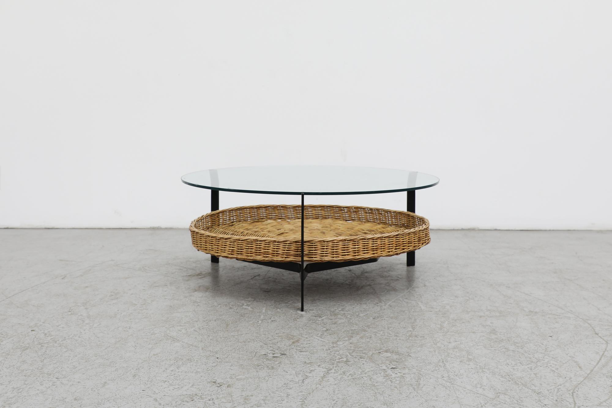 This mid-century black enameled bent metal glass top coffee table is classically designed by Rudolf Wolf for famed dutch manufacturer Rohé Noordwolde. Influenced by the Bauhaus and De Stijl movements, this coffee table is highlighted by its sleek