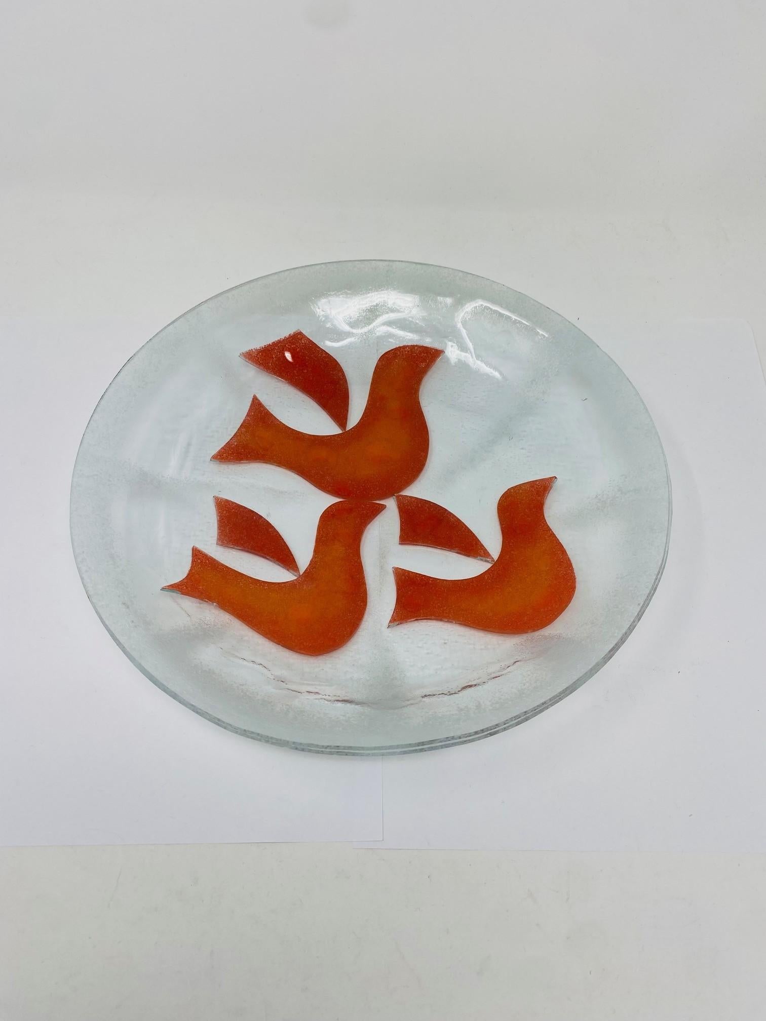 Beautiful and sculptural glass bowl with avian design. This incredible piece depicts 3 avian figures in an almost tangerine color against a clear glass background with frosted detailing around the piece.  Cheerful, inspiring and chic.  Great piece