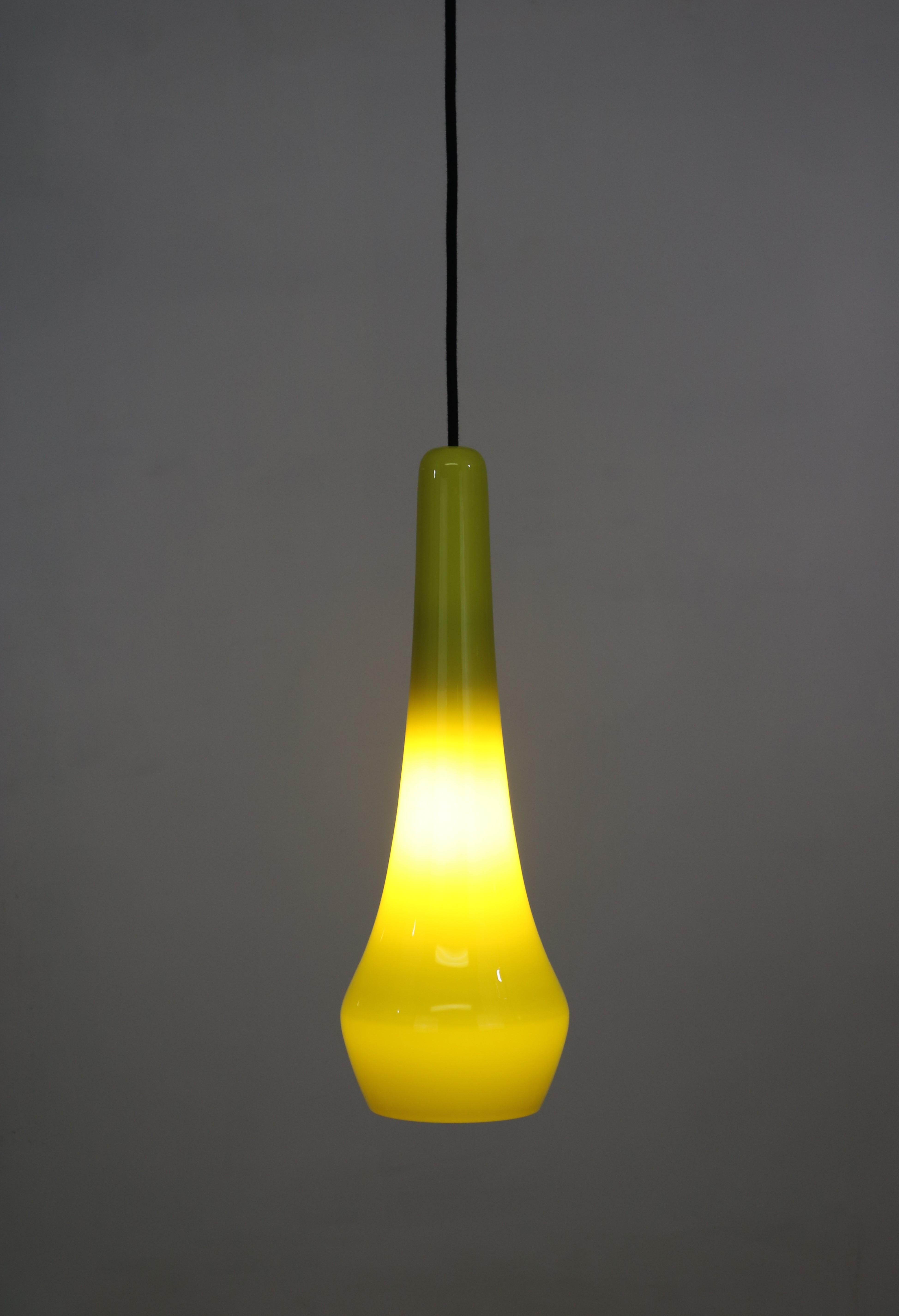 Midcentury Nordic yellow glass pendant lamp.
