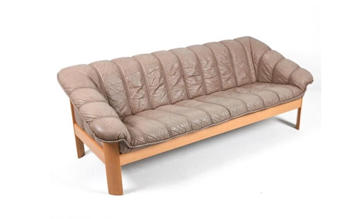 Mid-century Norwegian Post Modern Ekornes leather teak sofa. Great light brown/tan leather with solid Blonde birch wood frames. Beautiful condition and very comfortable. Great Norwegian design. Good vintage condition shows normal wear - very
