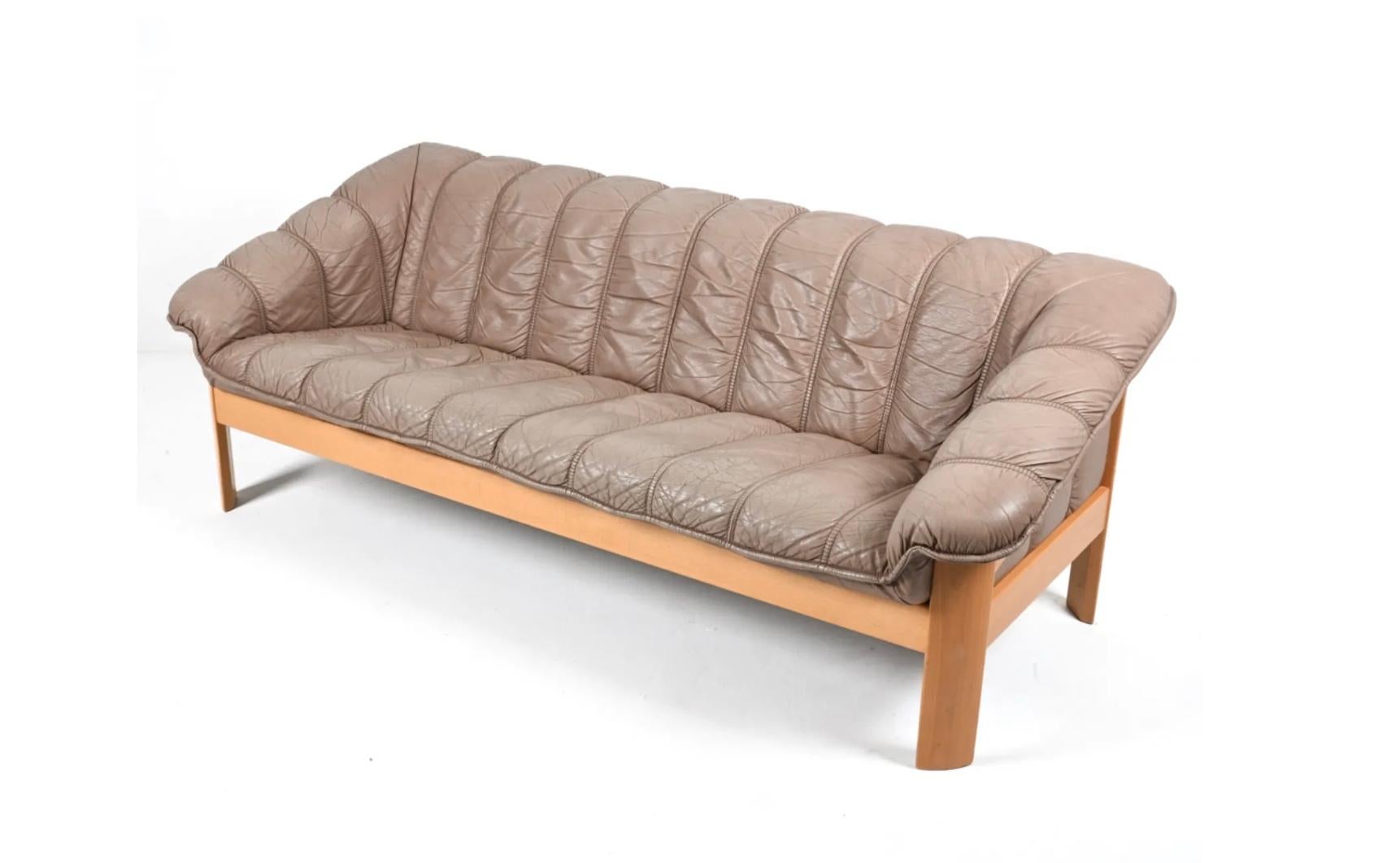 Mid-century Norwegian Post Modern Ekornes leather teak sofa. Great light brown/tan leather with solid Blonde birch wood frames. Beautiful condition and very comfortable. Great Norwegian design. Good vintage condition shows normal wear - very