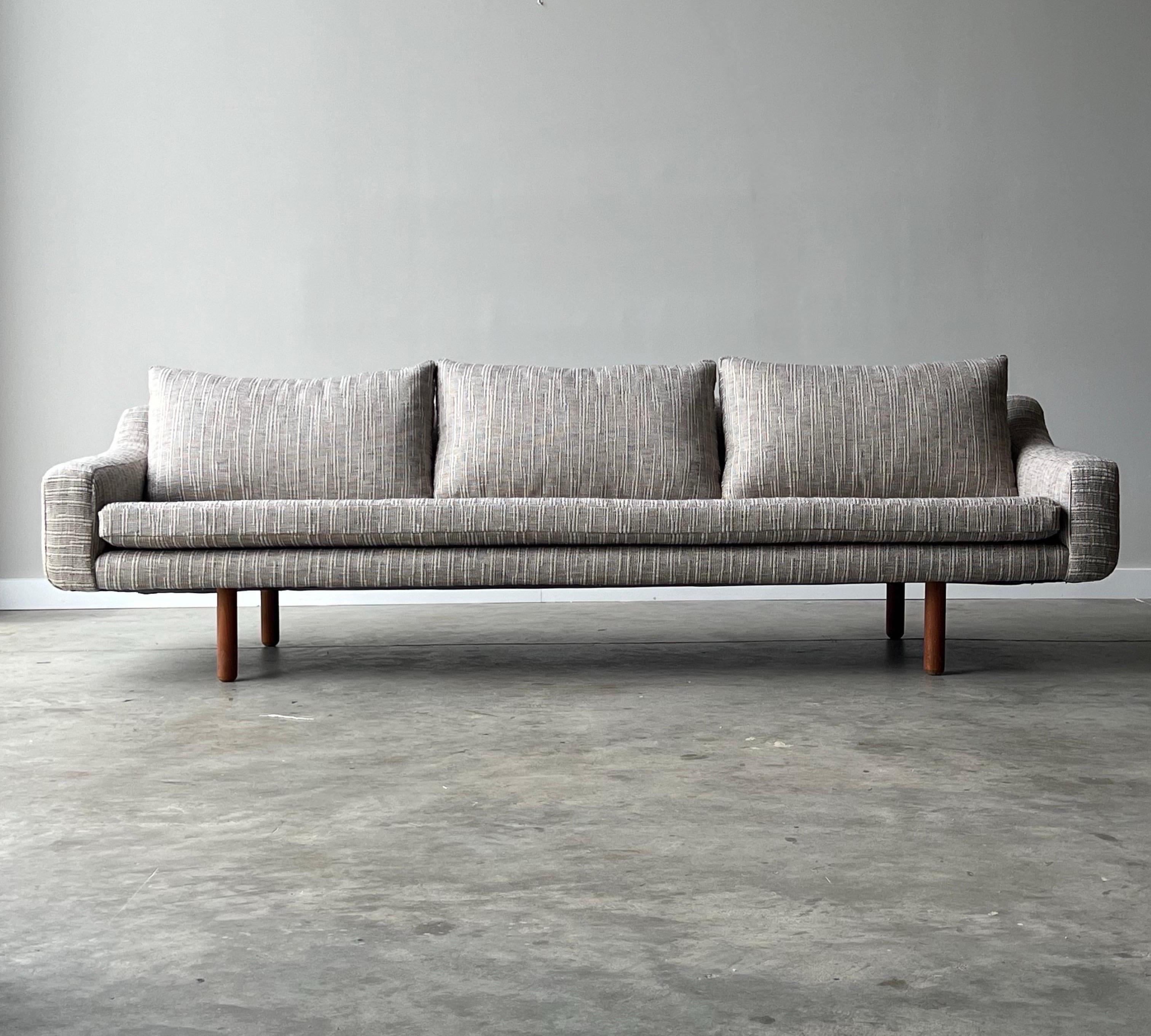 Mid-century sofa designed by LH HIELLE, Norway. This sofa is unique in design with a traditionally mid-century boxy front profile, yet has subtle curves and soft lines along the armrests and back. The side profile is vaguely reminiscent of the