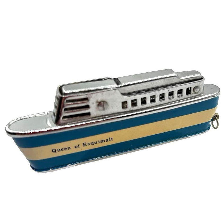 Mid-century Sarome 'Cruiser' lighter, shaped like a Cruise ship, features a chrome body enameled red and crème accents and 