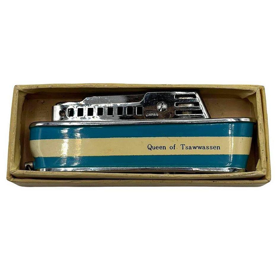 Mid-century Sarome 'Cruiser' lighter, shaped like a Cruise ship, features a chrome body enameled red and crème accents and 