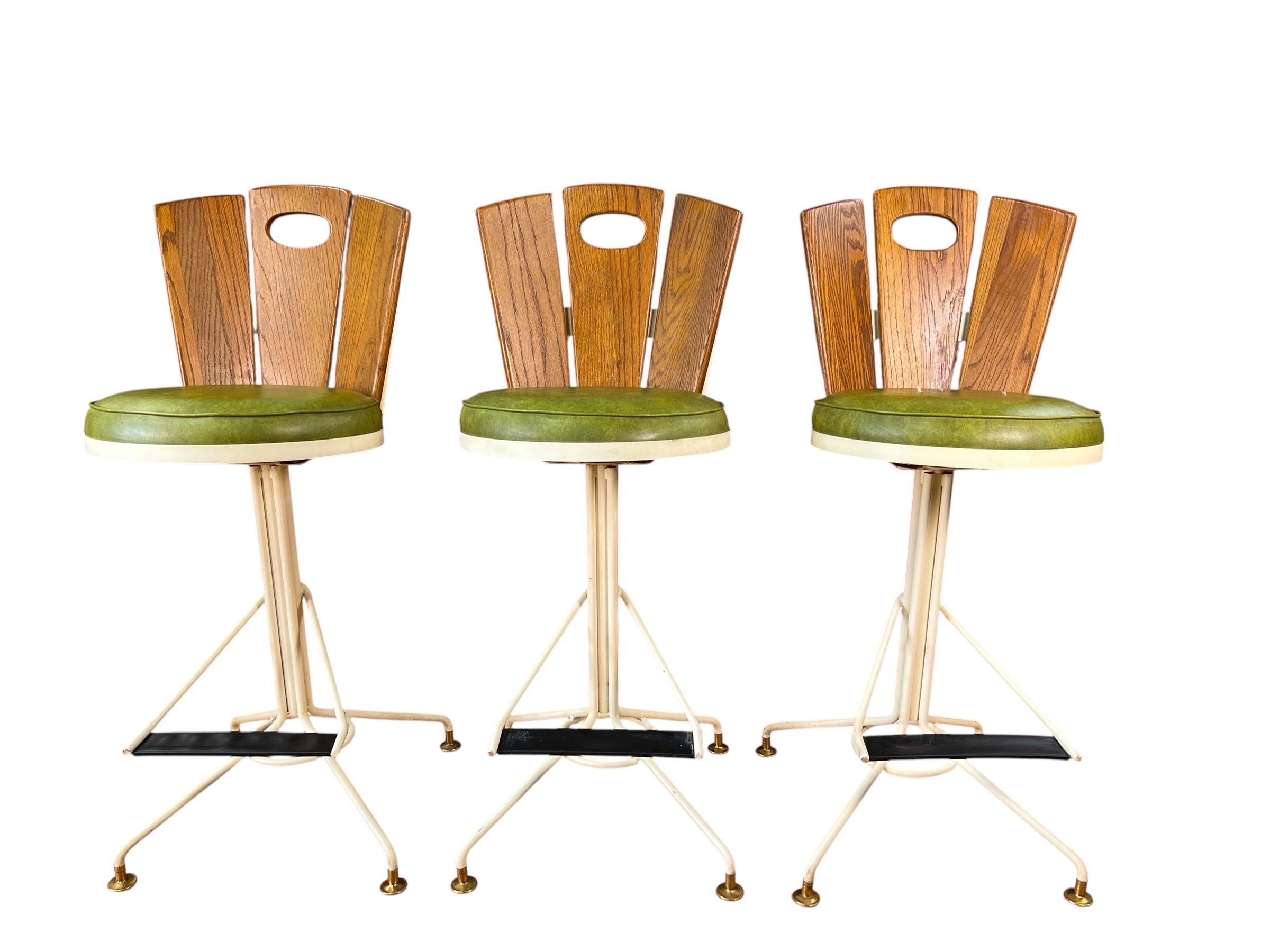 These chairs are exceptionally well-crafted and of high quality, boasting a substantial weight that reflects their durability. Each chair features a stamp under the seat indicating its production date, which is 1969.