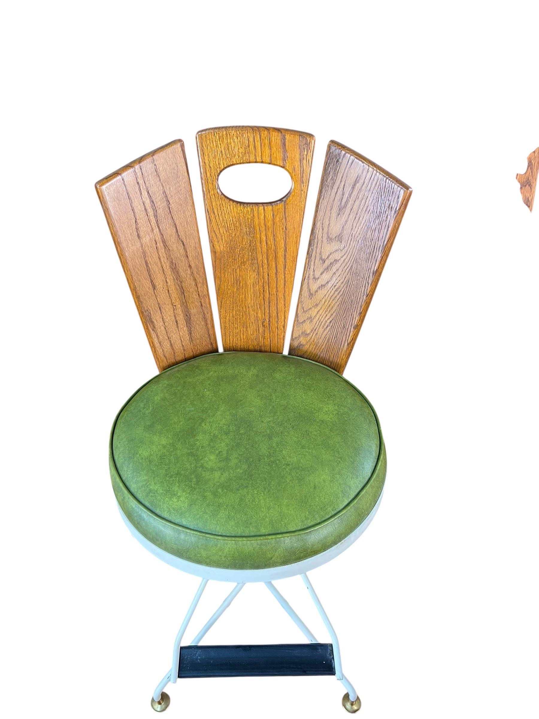 Mid-Century Modern Mid Century Oak and Cast Iron Swivel Bar Stools - Set of 3 For Sale