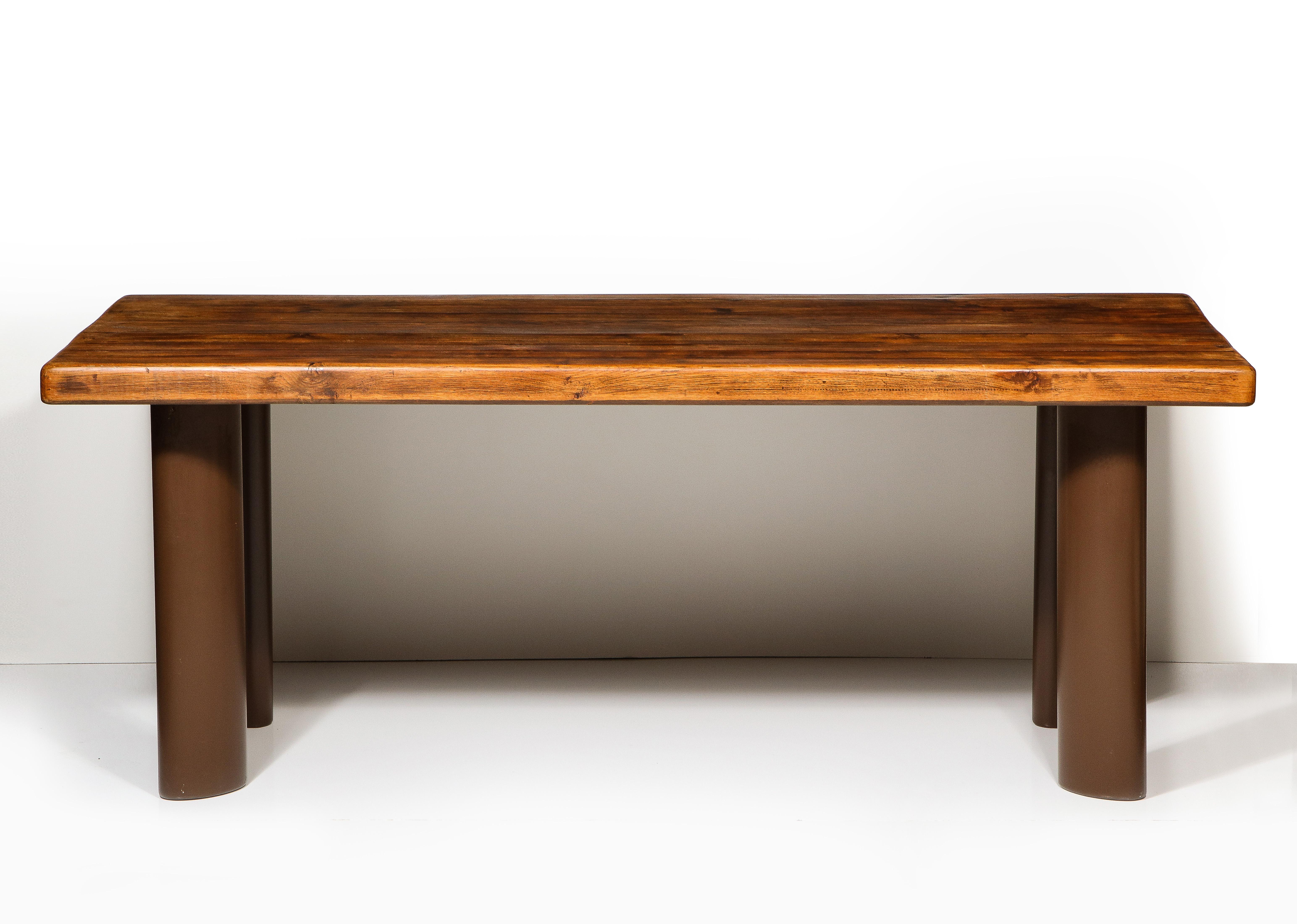 Oak and metal dining table in the Manner of Charlotte Perriand, France, c. Mid-20th century 

This simple yet highly sophisticated dining table is derived from a 1935 model that Perriand conceived and fabricated for clients Paul and Ange Guttmann.