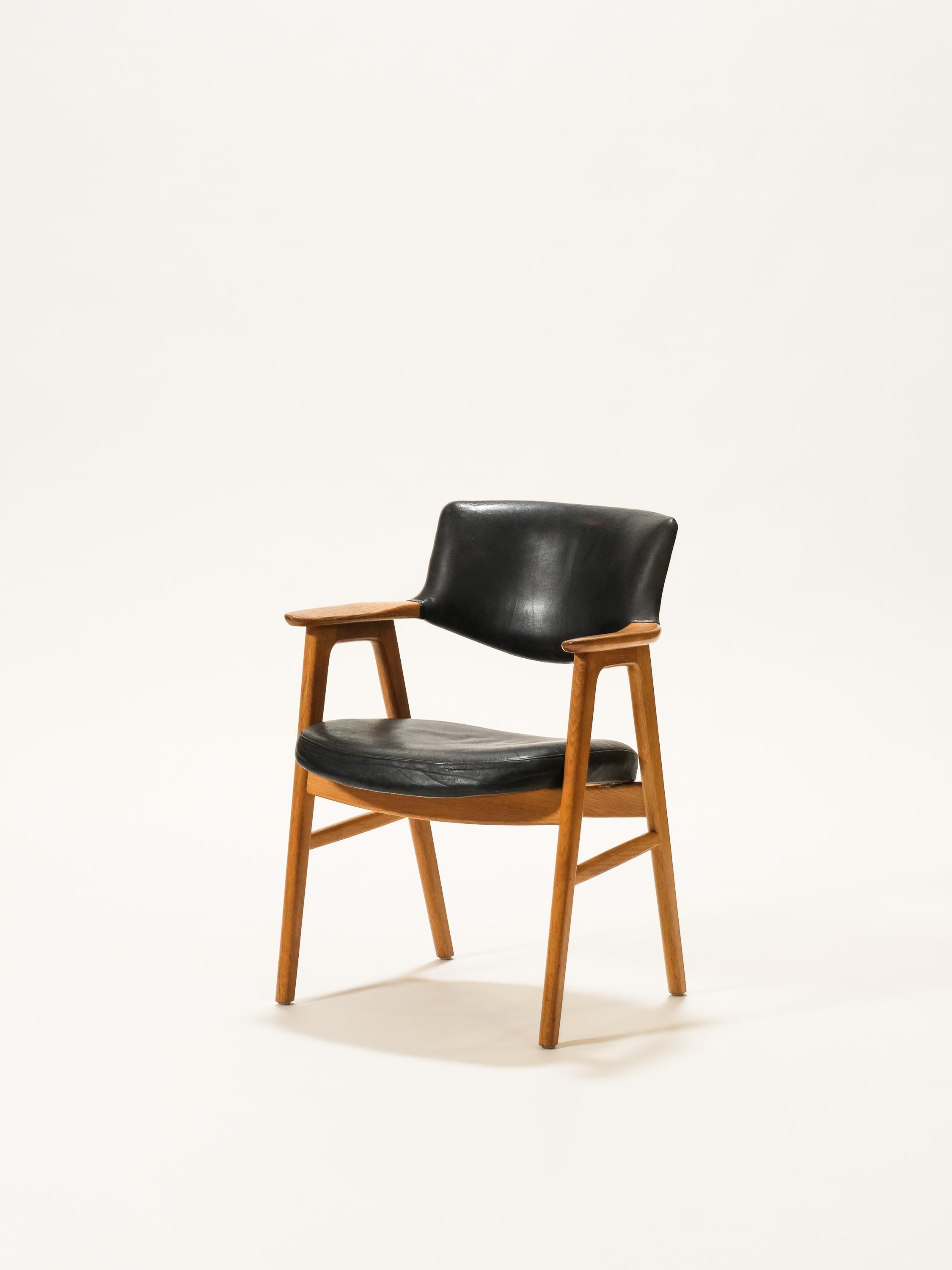 Danish oak and leather armchair by Erik Kirkegaard. Black leather with patinated oak frame.