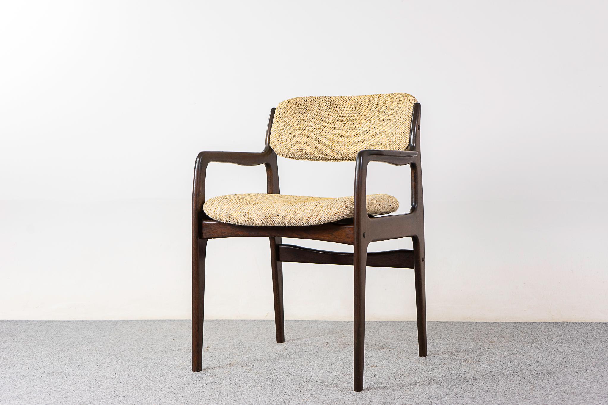 Oak arm chair, circa 1970's. Stained solid oak frame, original upholstery with minor wear. 