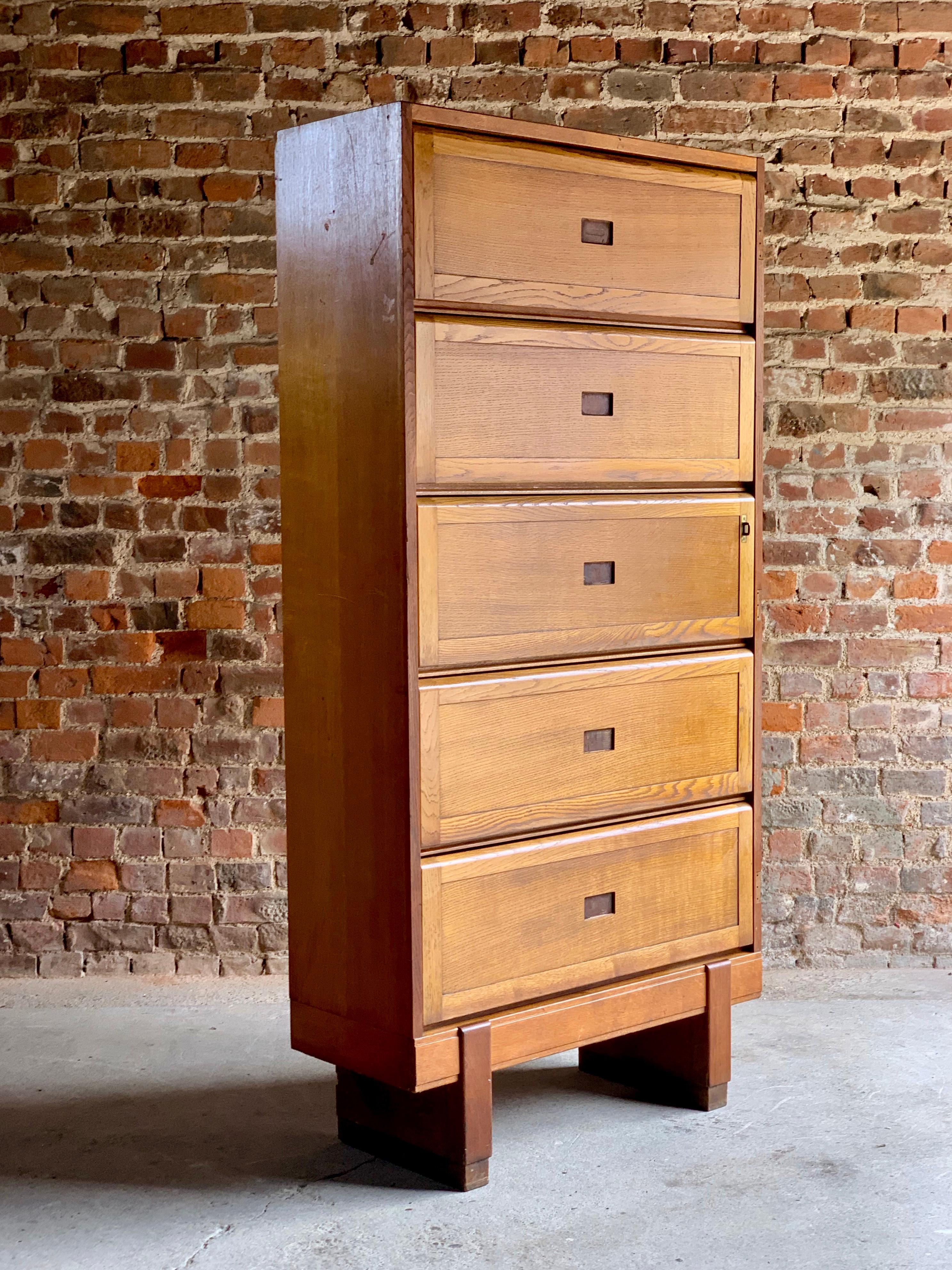 Mid-20th century large oak five shelf cabinet dated 1956, the rectangular top over five up and over sliding action doors, raised on block feet, stamped to the back crowned Government ER Staverton, These units would have been used at RAF Staverton in