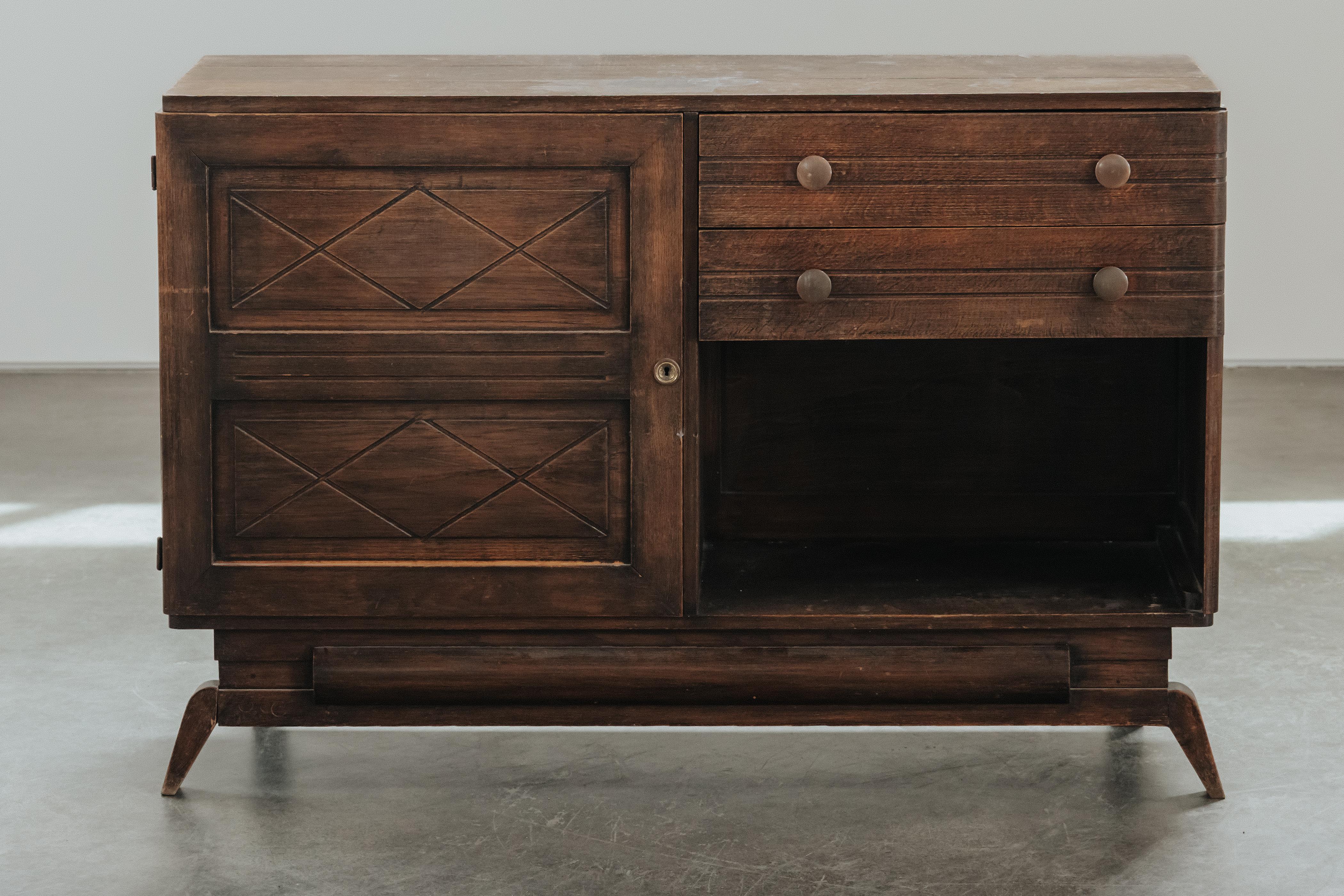 Mid Century Oak Credenza From France, Circa 1960.  Solid stained oak construction with original hardware and key.  Excellent condition.