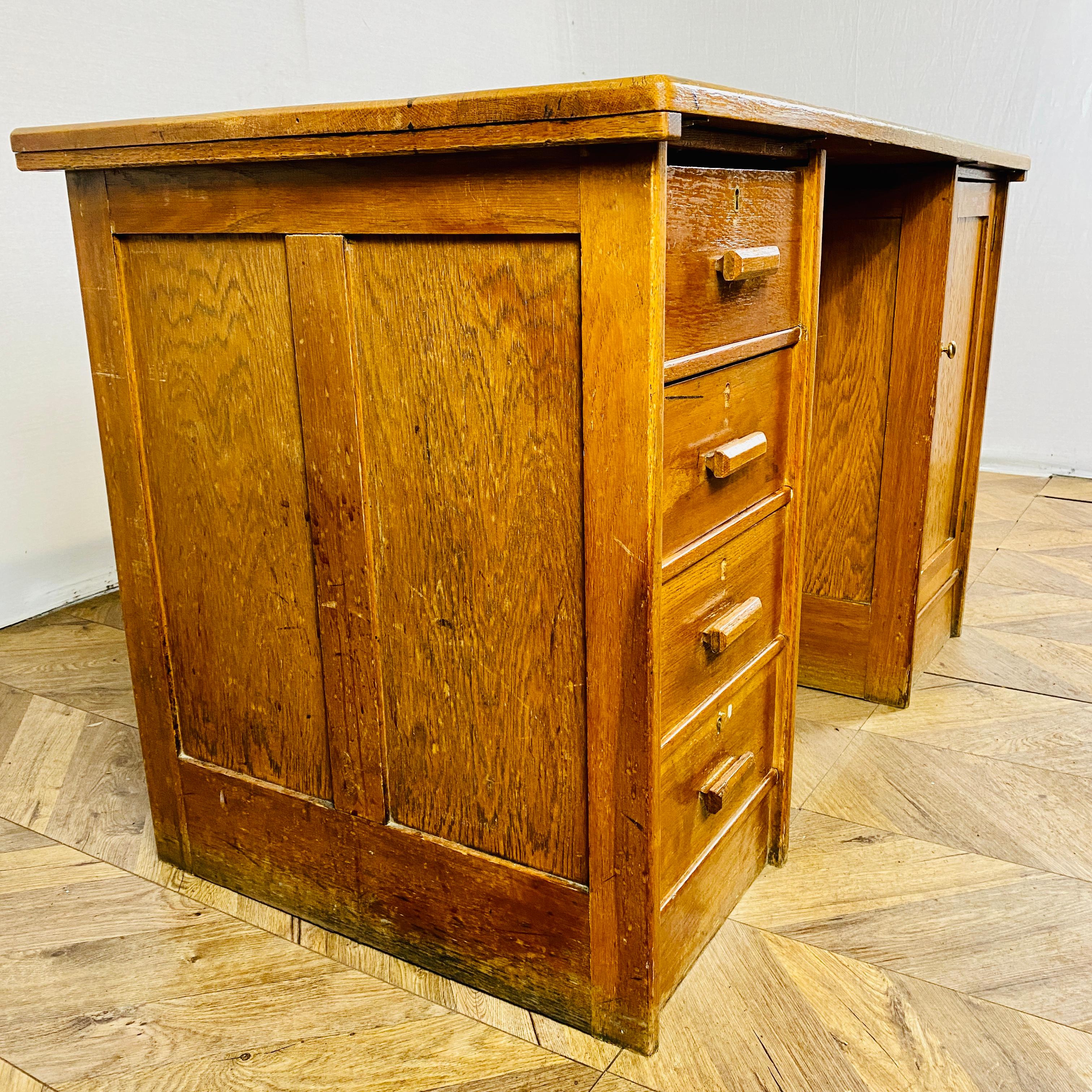 A beautifully large vintage, mid century oak pedestal desk, circa 1940s.

The desk, which came directly from the University of Cambridge, is in good vintage condition with age related marks and scuffs, which really add to its patina and charm but