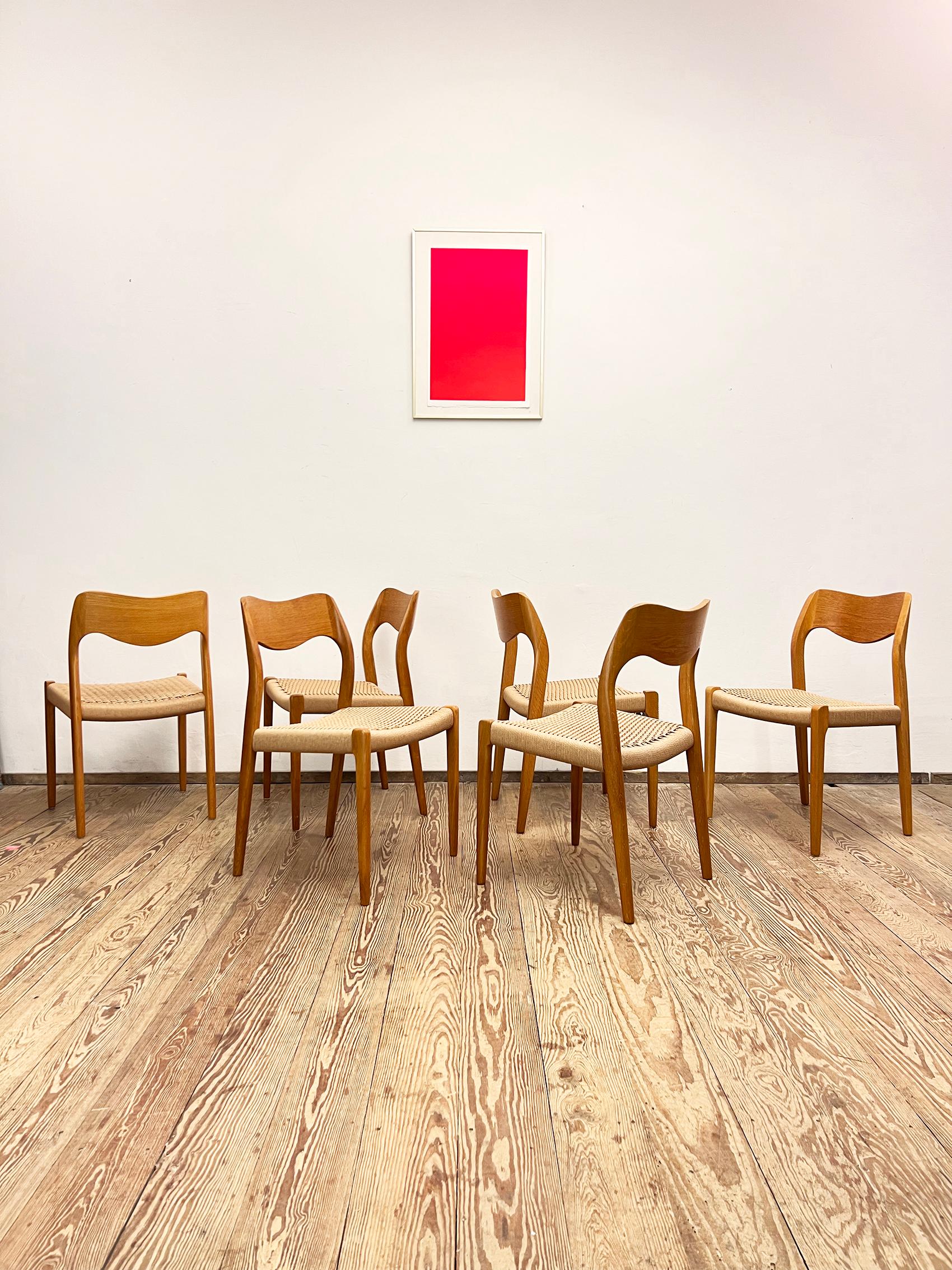 Dimensions 49 x 49 x 79 x 44cm (Width x Depth x Height x Seat height)

Danish Design by Niels O. Møller manufactured by J. l. Møller in Denmark. The set features 6 dining chairs made out of oak wood, partially veneer and paper cord seats. The side