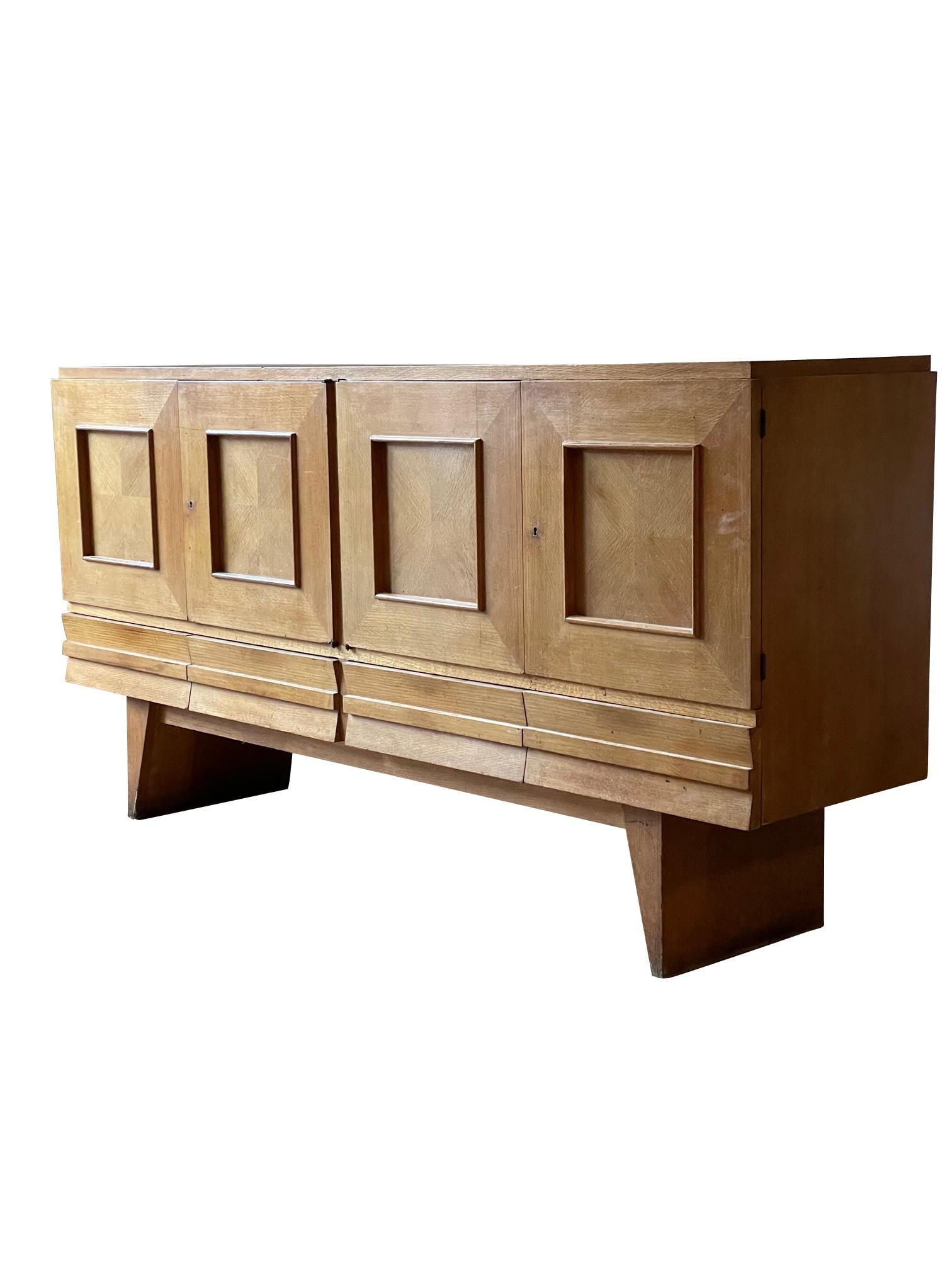 1950's French oak credenza
Four doors as well as four hidden drawers
Seven interior shelves
Decorative mitered panels on door fronts
Arriving tbd.
