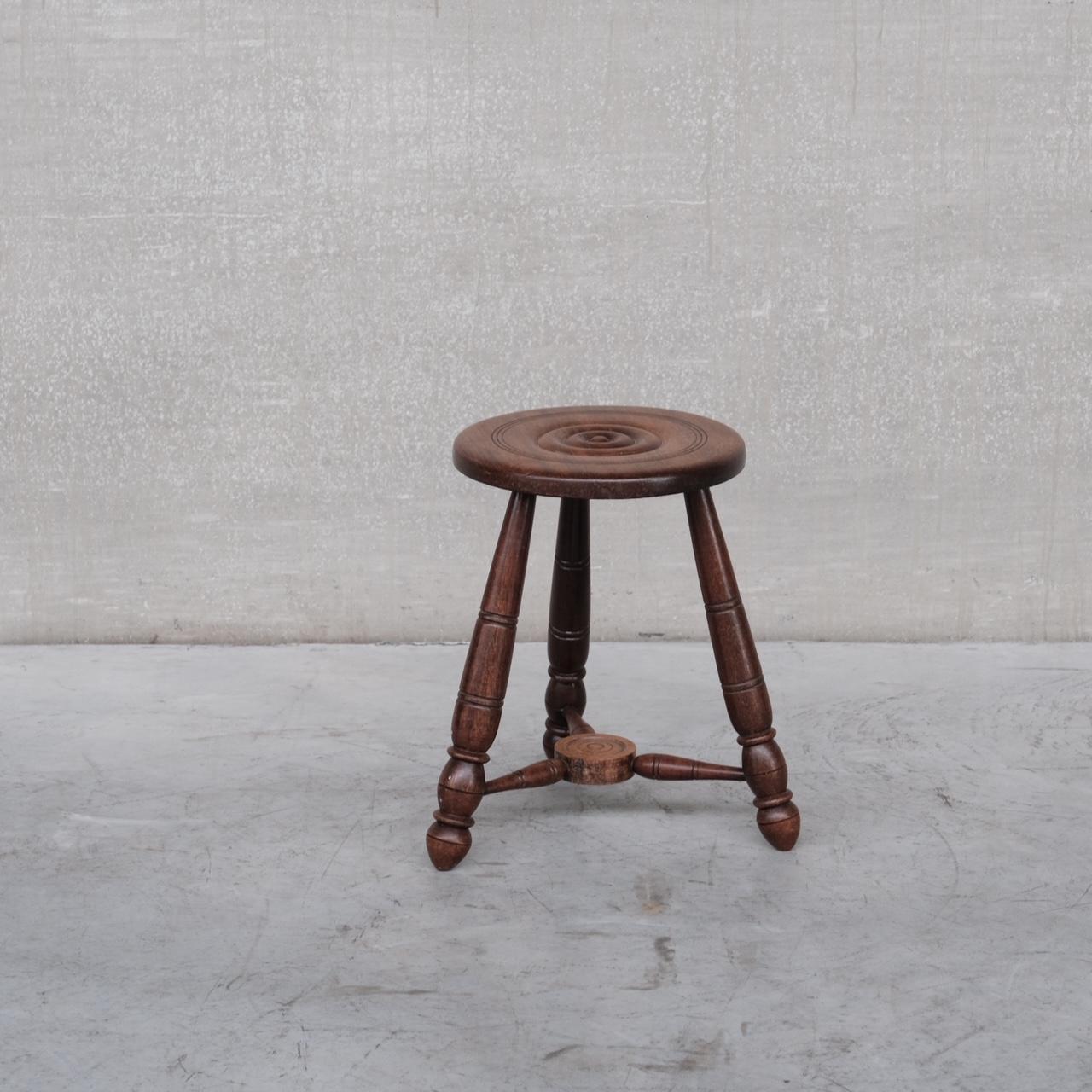 A well formed side table or stool. 

France, c1950s. 

Solid turned oak, in the manner of Charles Dudouyt. 

Late art deco towards mid-century. 

Good condition, some scuffs and wear commensurate with age. 

Location: Belgium Gallery.