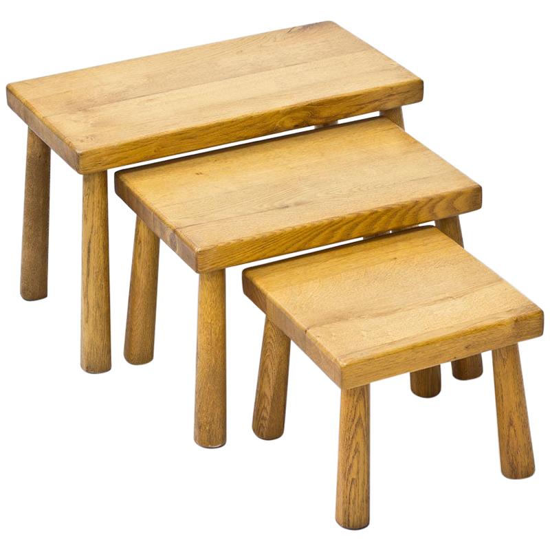 Set of nesting tables from unknown designer and maker, most likely manufactured in Belgium during the 1950s. Made from solid oak.

Dimensions: H 27.5 to 38.5 x W 32 to 60 x D 32cm.