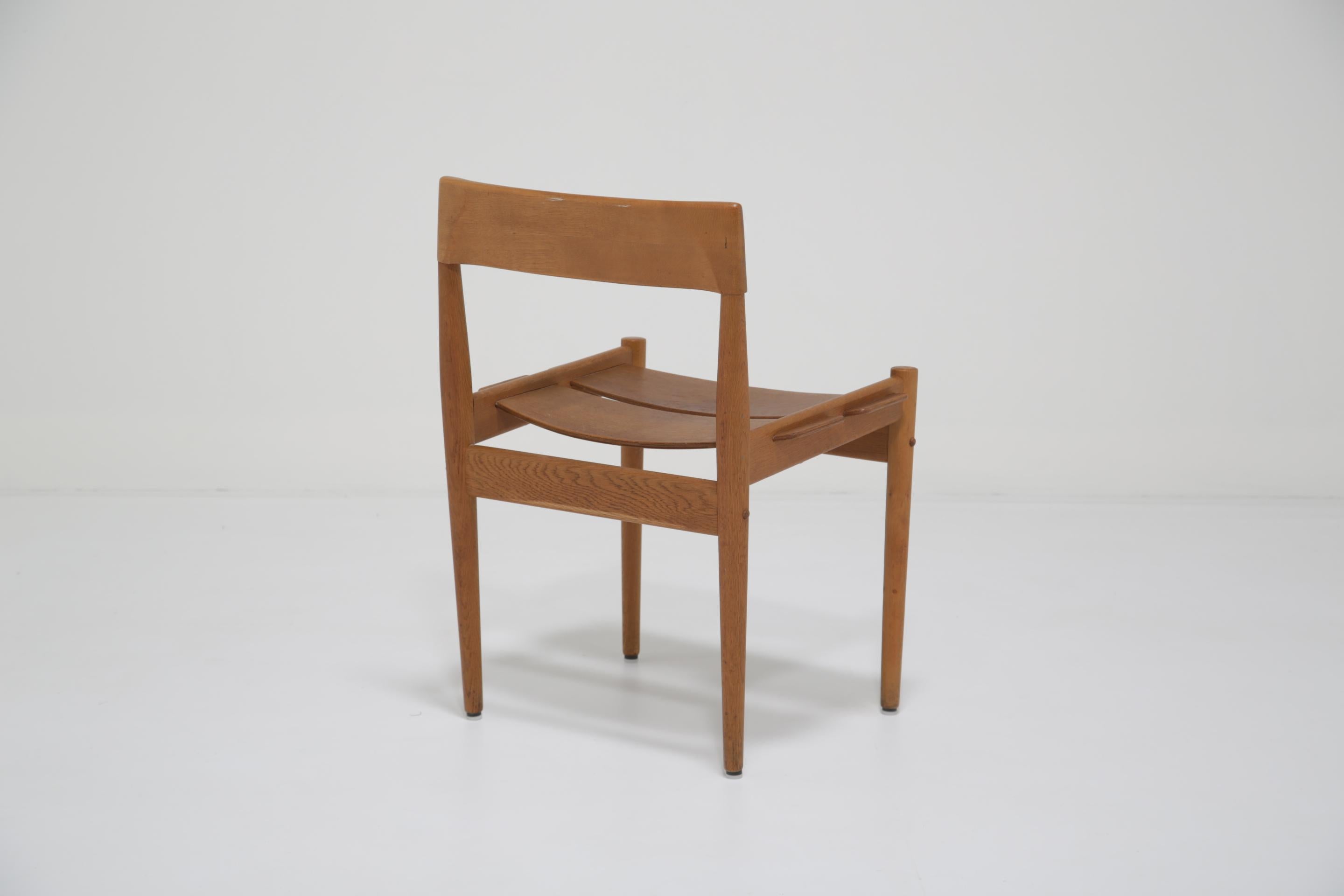This oak side chair, model PJ3-1, was designed by Grete Jalk for Poul Jeppesen in the 1950s. Known for her focus on organic form and everyday functionality, Jalk helped shape postwar Danish design with pieces that were both modern and approachable.