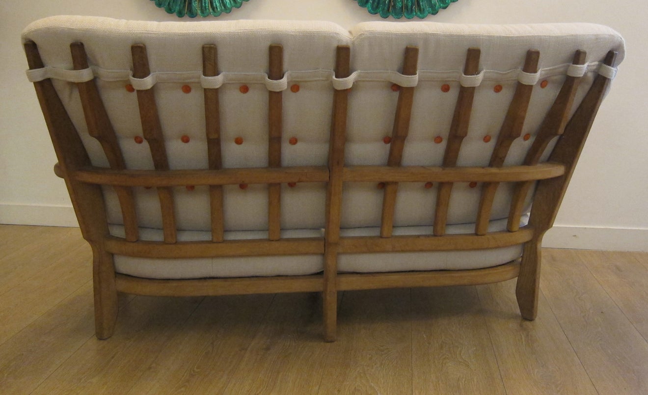 Mid-Century modern oak settee by Guillerme et Chambron, France 1950.
 Organically shaped, clean-lined and elegantly simple with iconic finger back.
Retains a beautiful warm patina.
Newly upholstered
Available to view in situ in our Miami gallery

 
