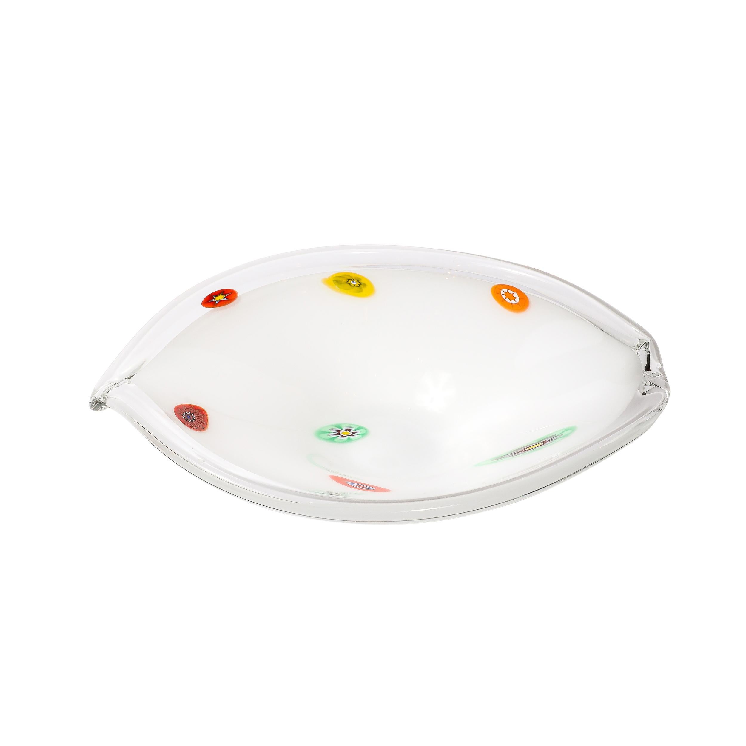 This serene and brilliantly formed Mid-Century Modernist Oblong Hand-Blown Murano Glass Bowl in White with Millefiori Detailing and Translucent Edge originates from Italy, Circa 1950. Features a lovely balance of techniques and detailing, with an