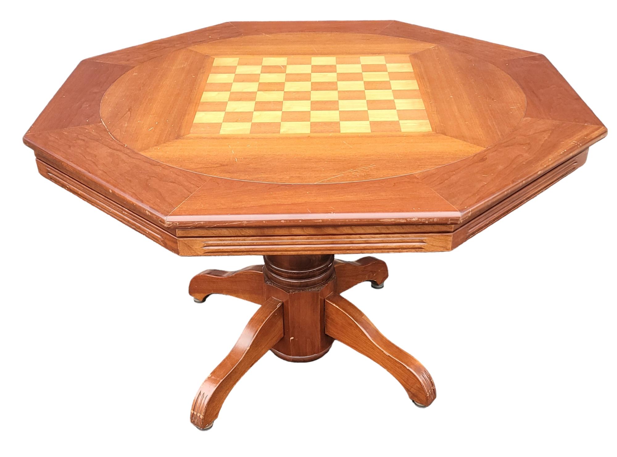 Mid Century Wooden Game Table for cards or chess. This game table may be flipped to provide a different game table. There are pegs to protect the edges from scratching when flipped. There is a red center cloth for a clear center gaming area within