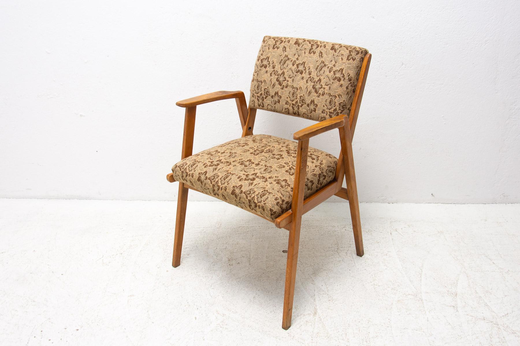 This armchair was made in the 1960´s. It can be used as an office chair or lounge chair. Typical for Czechoslovak design following the enormous success of the Czechoslovak Pavilion at the exhibition EXPO 58 in Brussels. Made of beechwood and fabric.