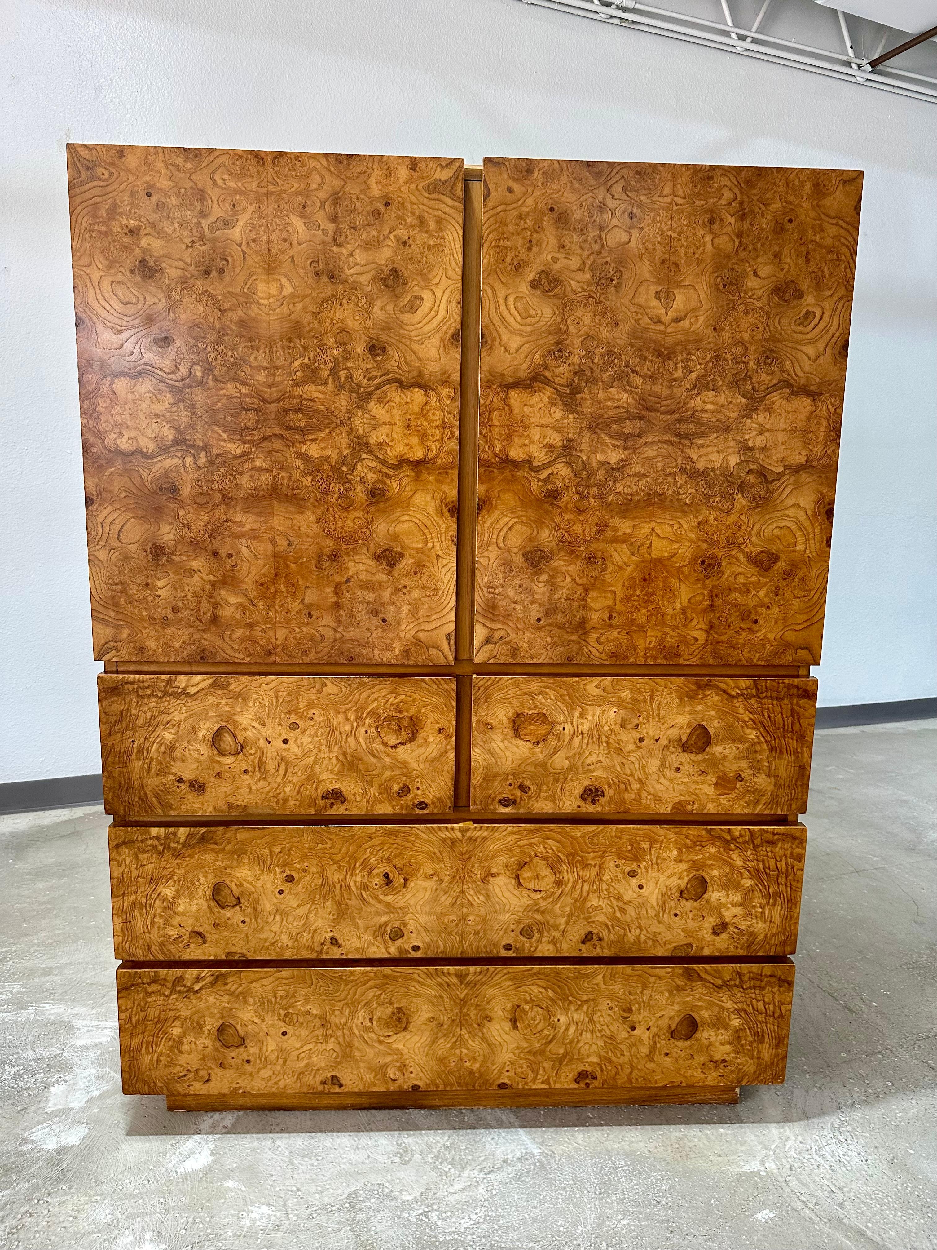 Vintage 1970’s Olive Burlwood Gentleman’s Chest or Armoire designed by Roland Carter for Lane Furniture, part of the Alpha Collection. Often incorrectly attributed to Milo Baughman. 

5 drawers, below the cabinet storage above. One single drawer