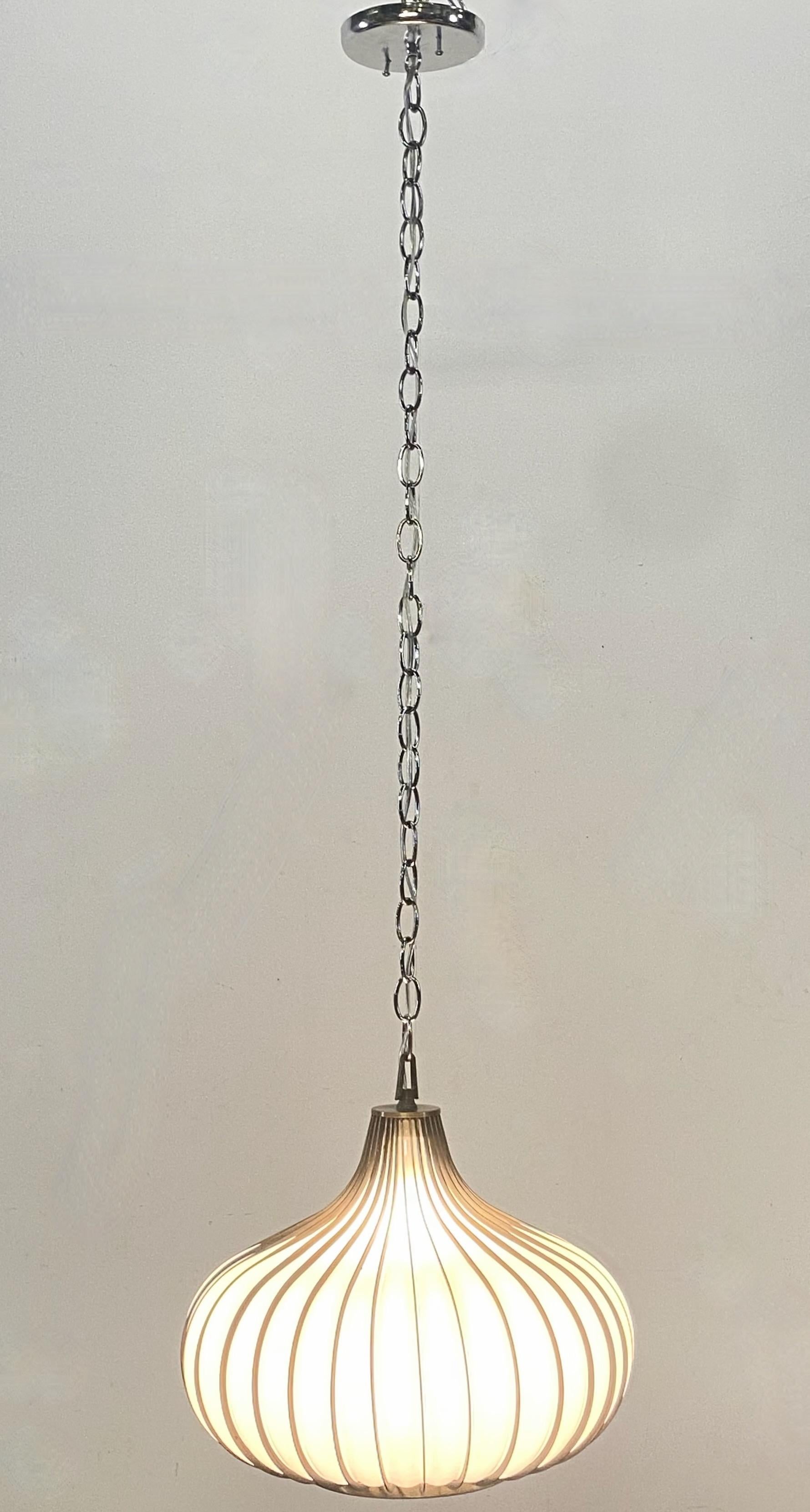 Mid-Century Modern style garlic or onion shaped, swag, pendant light fixture with
blown white glass shade encased in a steel frame. 
Newly re-wired, re-furbished and ready to install.
American 1960's.
In excellent condition.
We can shorten the