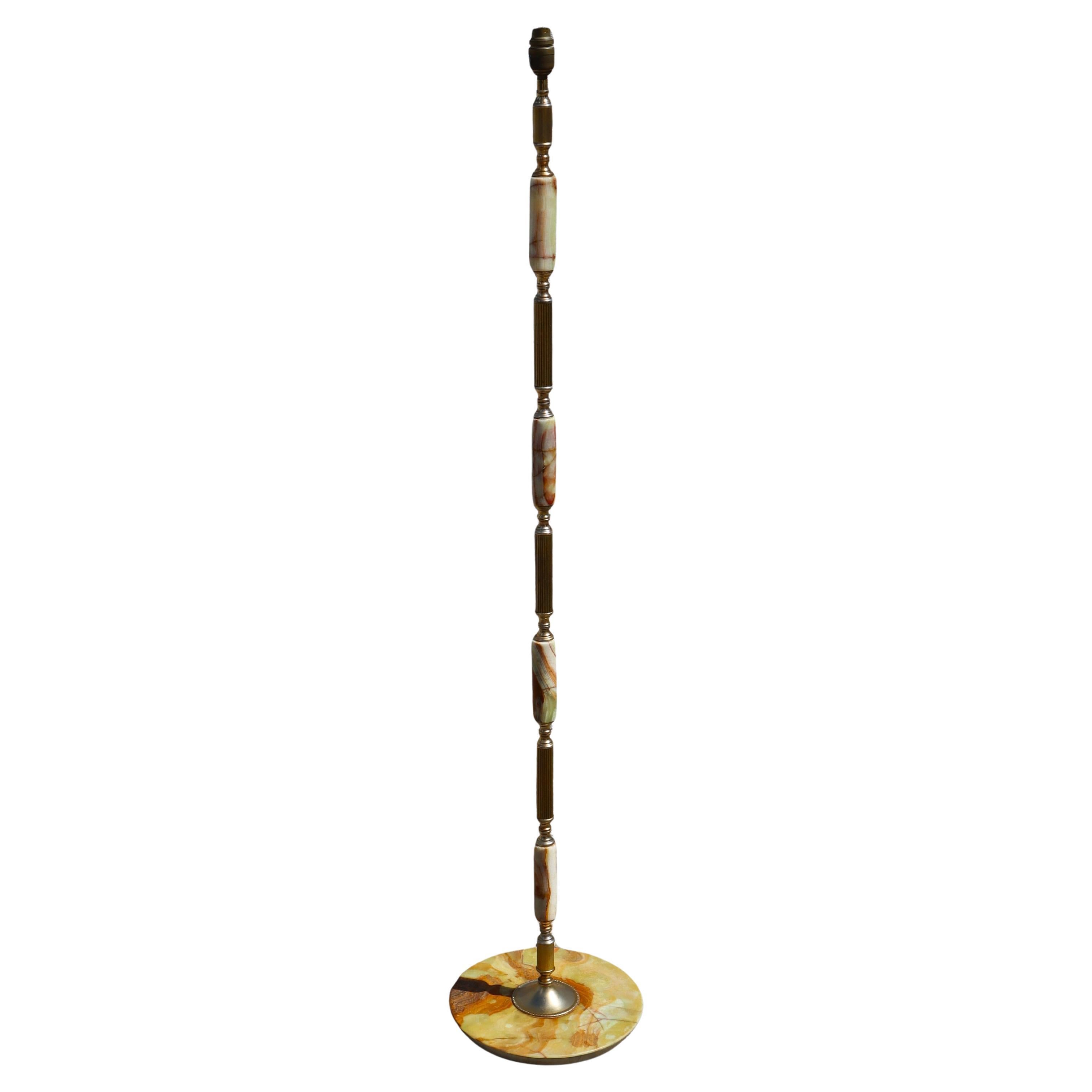 Wonderful Mid-Century Green Onyx and Brass Floor Lamp - Contemporary Design from the 70s.
Freestanding Floor Lamp with solid green Onyx round base and an extravagant mix of Onyx Marble and gilt Brass Applications on the Lamp Column.
The Lamp has a